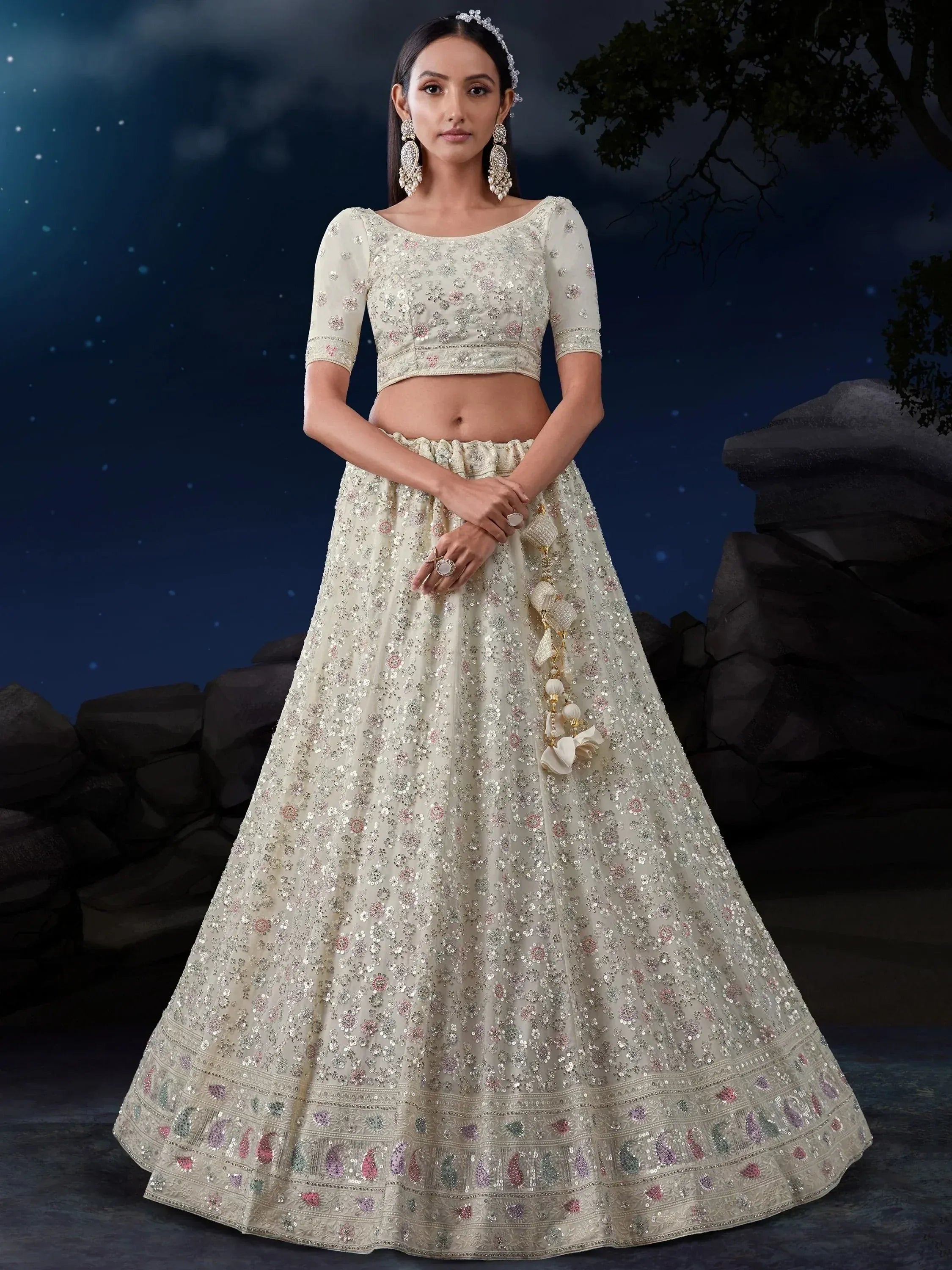 Elegant ivory lehenga choli with floral sequin embroidery, perfect for Indian weddings and festive occasions.