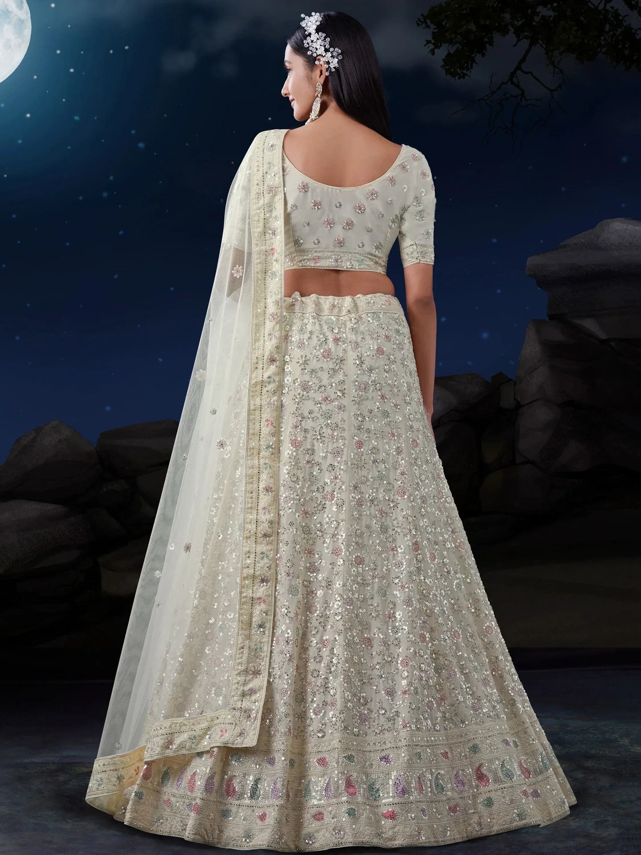 Elegant off-white lehenga choli with floral sequin embroidery, perfect for Indian weddings and festive occasions.