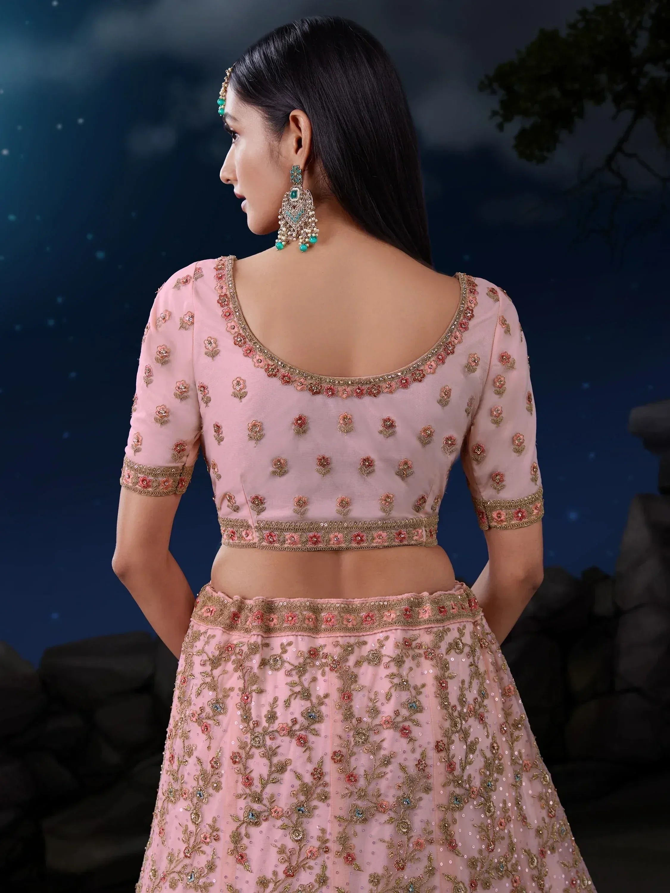 Pink floral embroidered lehenga choli with gold detailing, perfect for Indian ethnic wear events