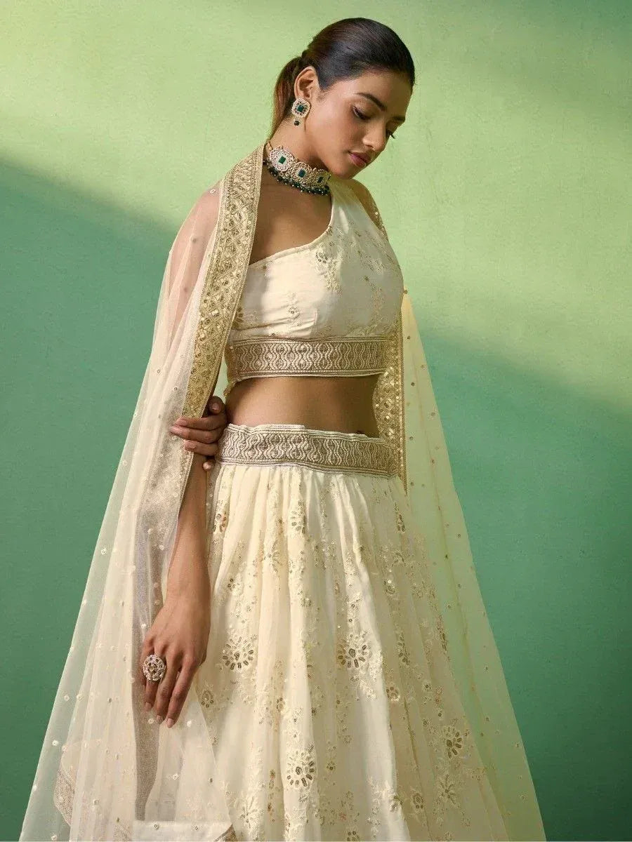 Cream embroidered lehenga choli with gold detailing and sheer dupatta, Indian ethnic wear