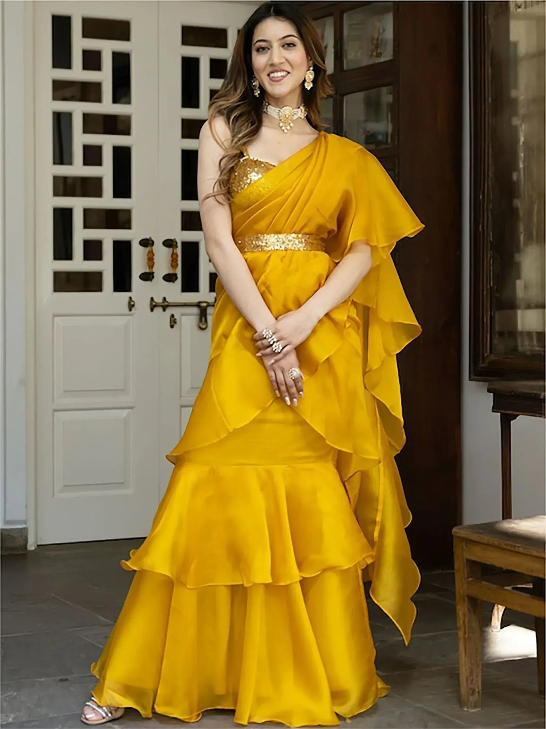 Yellow ruffle ethnic gown with sequin bodice and belt, perfect for Indian festive occasions