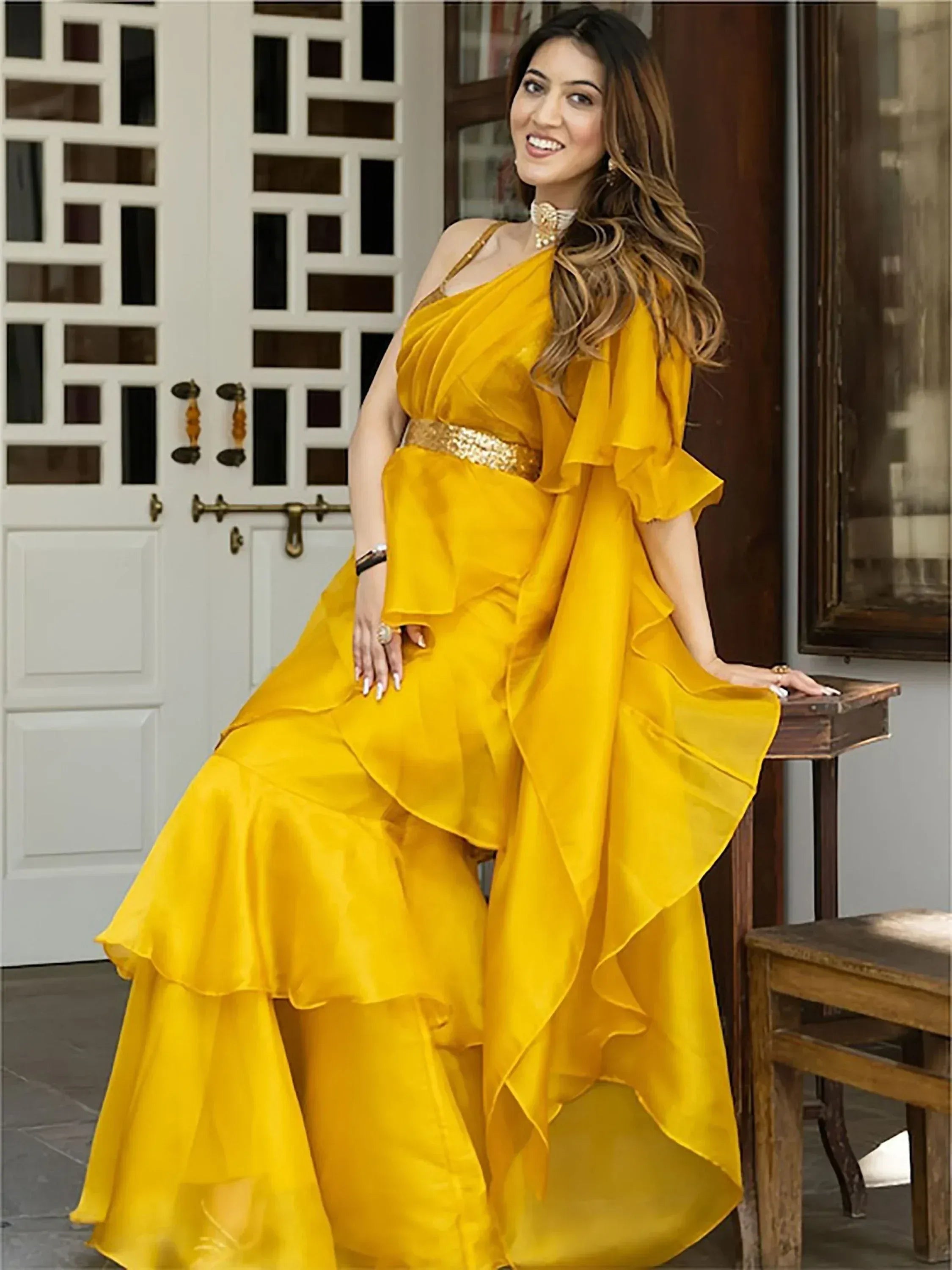 Yellow ethnic gown with ruffles and gold belt, perfect for Indian festive occasions
