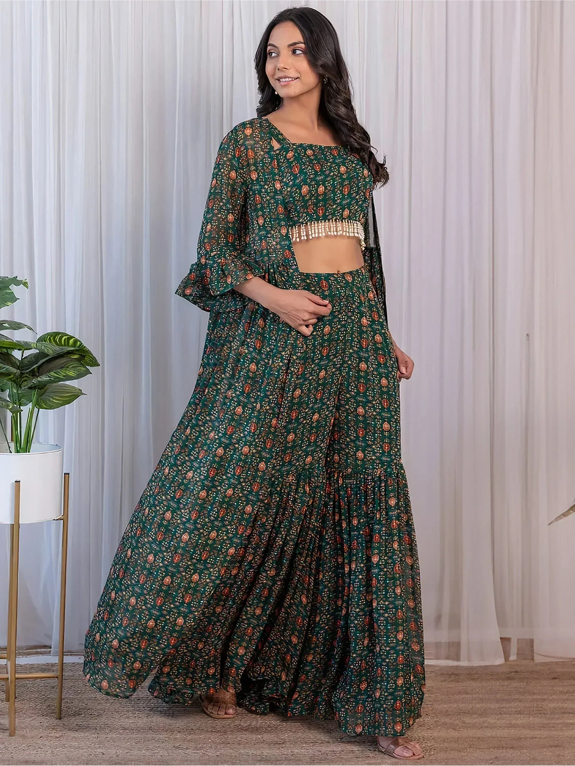 Green printed lehenga choli with bell sleeves and fringe detail, Indian ethnic wear