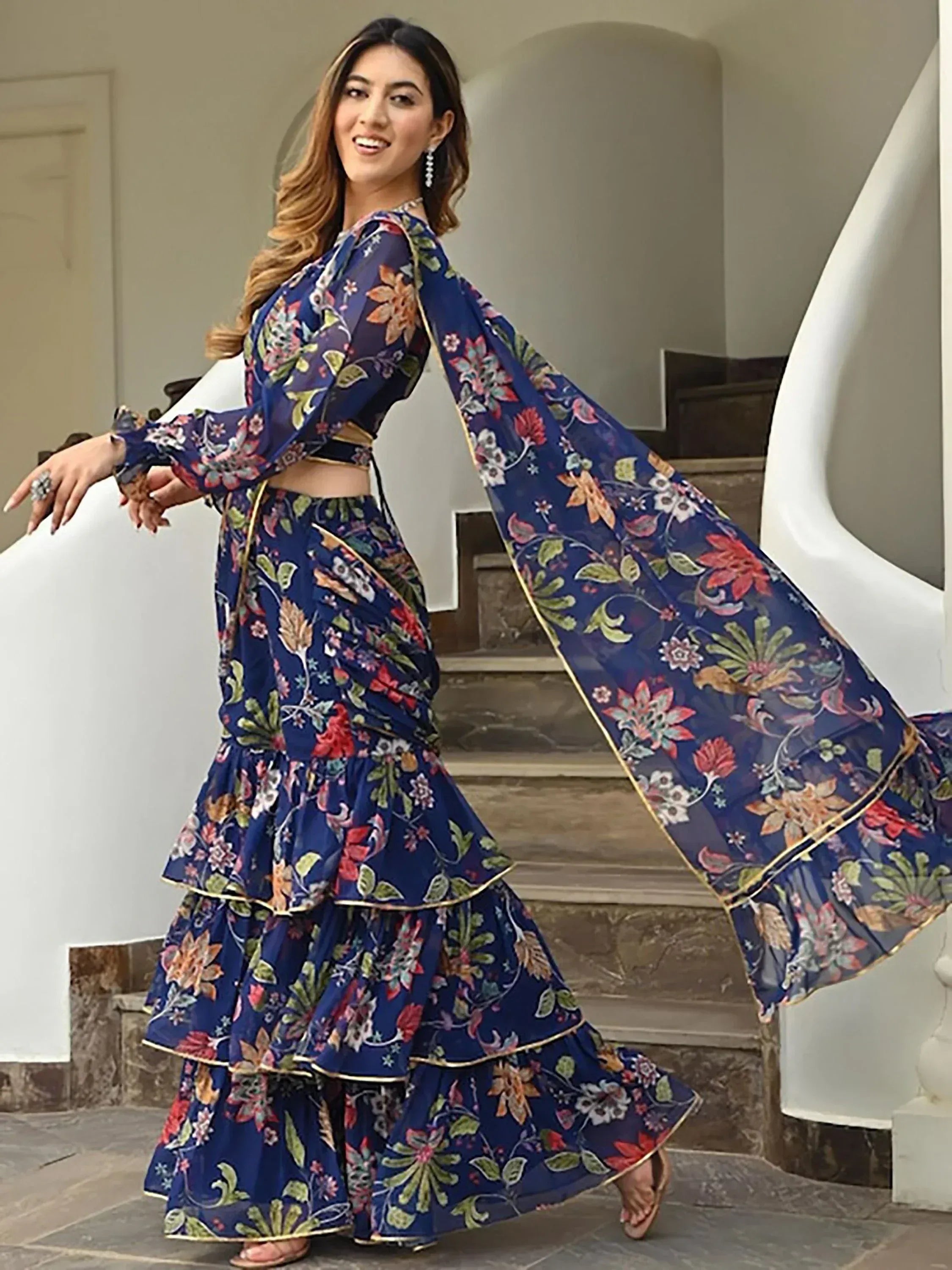 Blue floral printed lehenga choli with ruffled skirt and sheer dupatta, ideal for Indian ethnic wear occasions