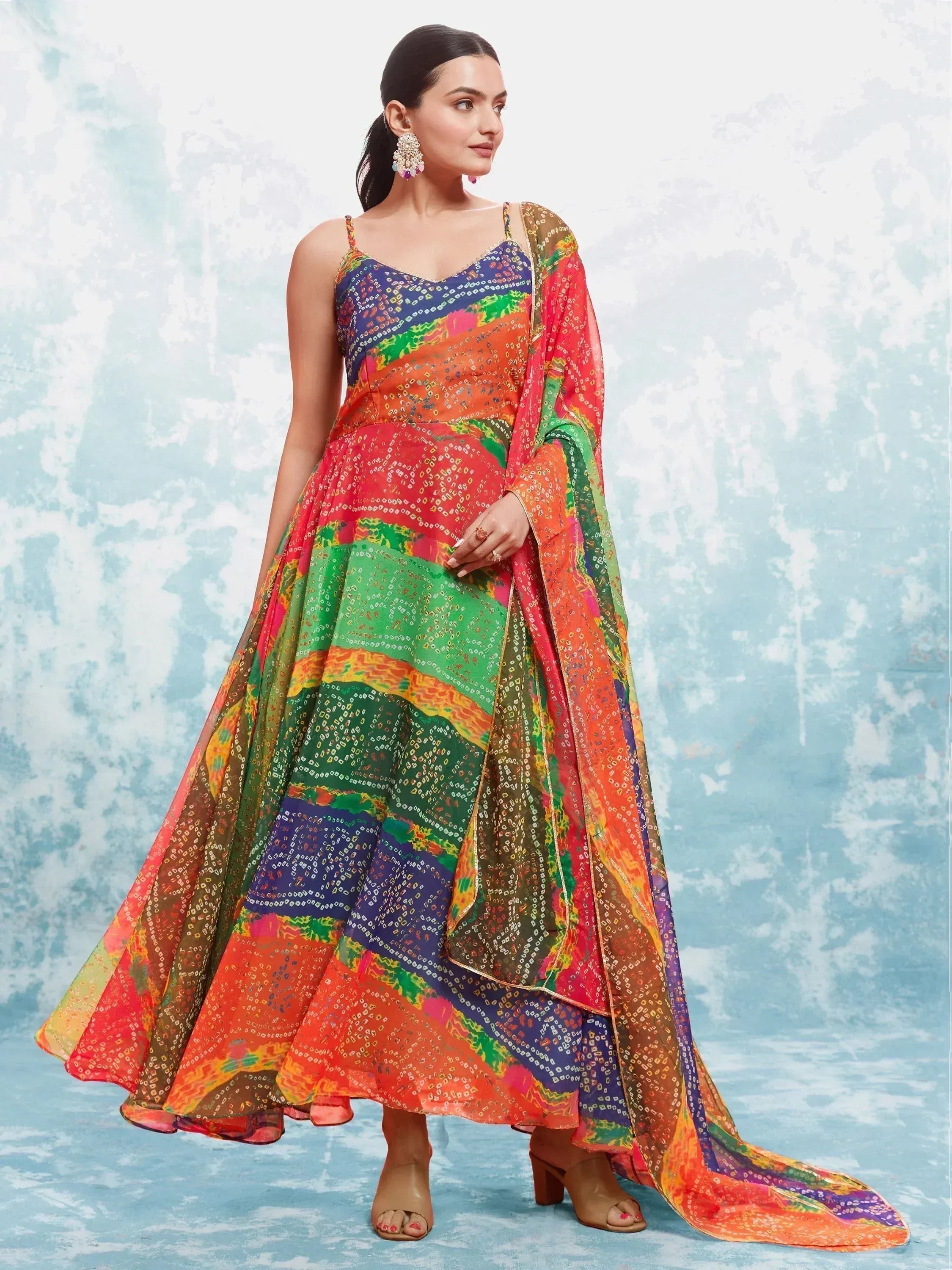 Woman wearing vibrant multicolor ethnic gown with dupatta, traditional Indian attire