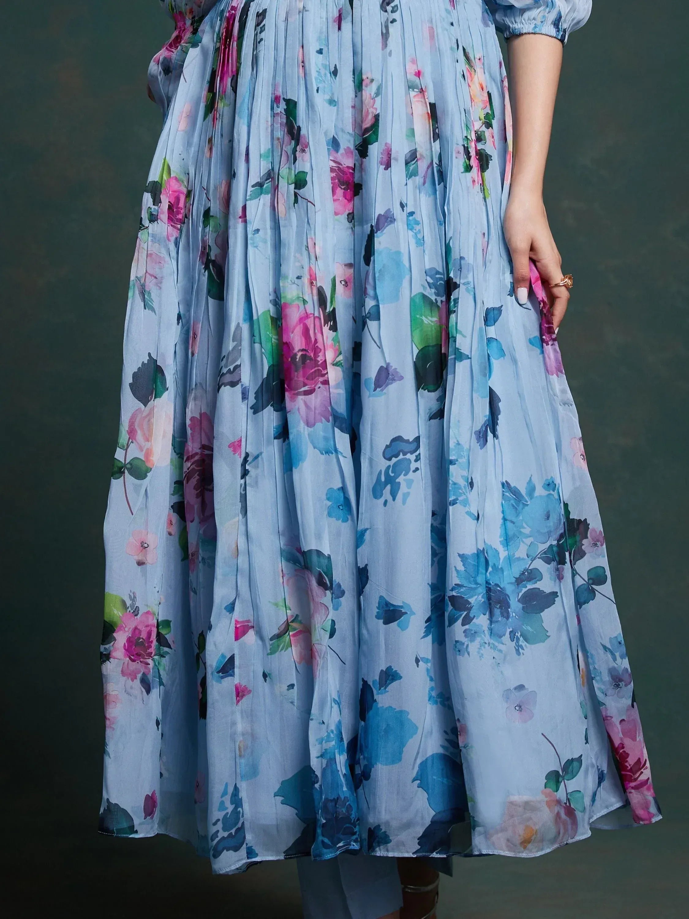Light blue floral print ethnic gown with pleated skirt and puff sleeves