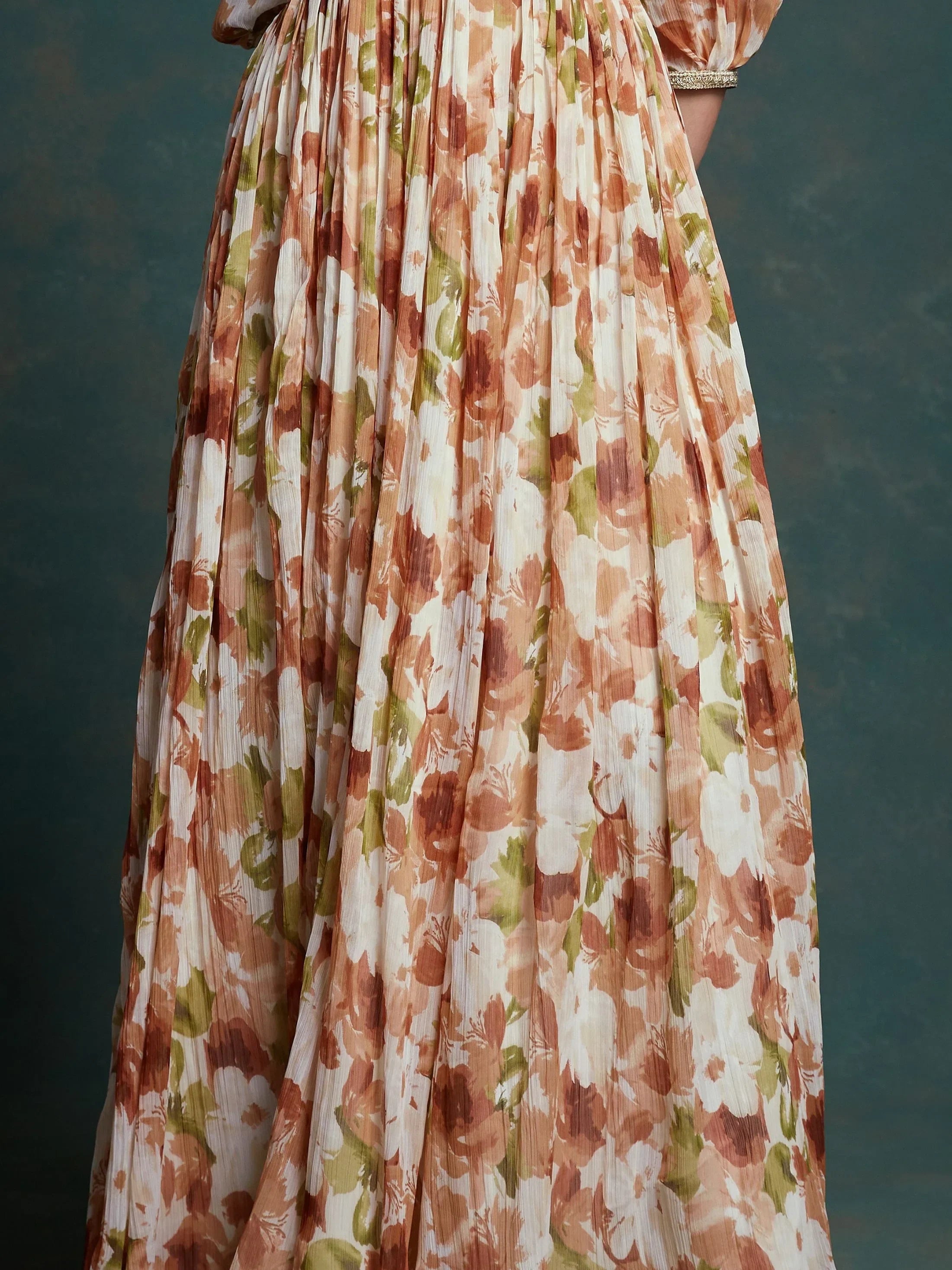 Pleated ethnic gown with floral print in beige, brown, and green tones