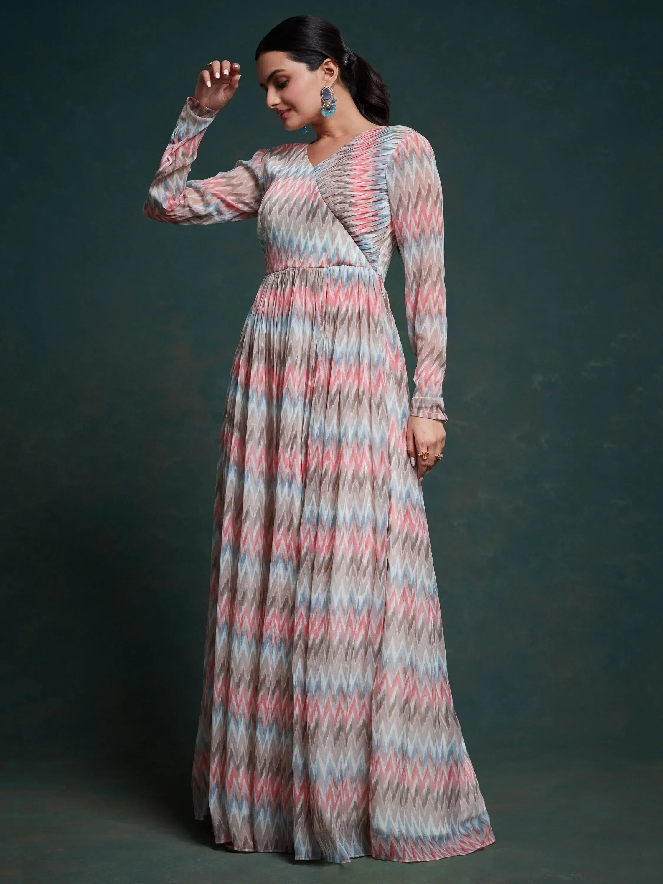 Woman in a pastel zigzag printed long ethnic gown with full sleeves