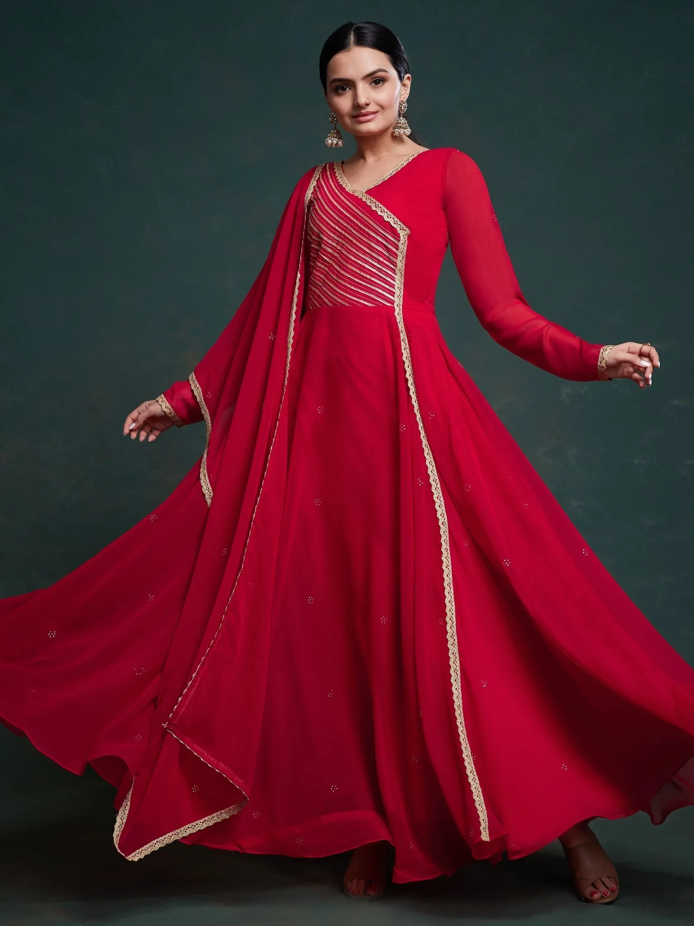 Woman in elegant red Anarkali suit with gold embroidery and dupatta, Indian ethnic wear