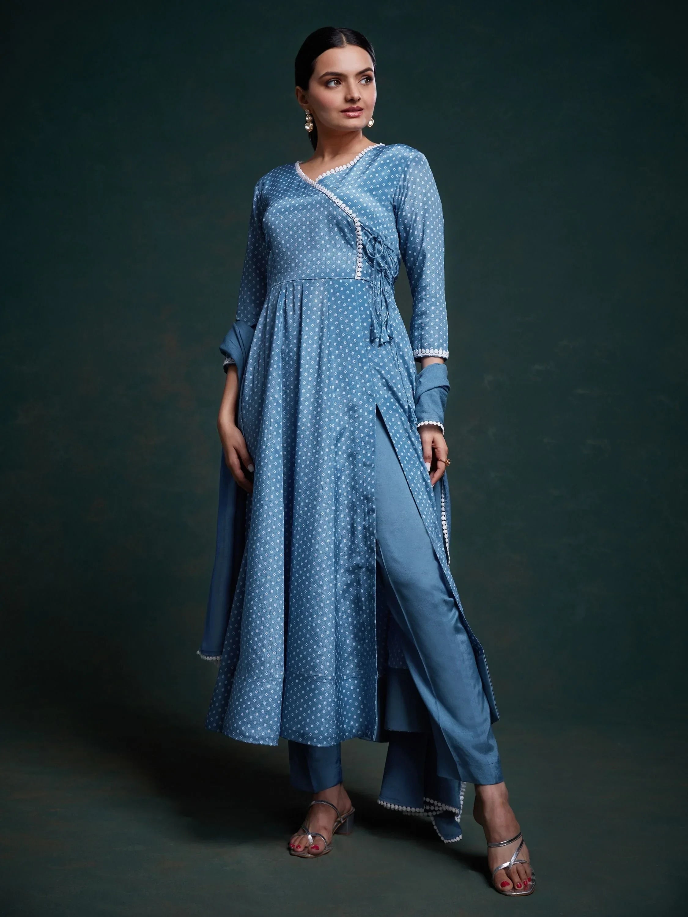 Woman in blue polka dot salwar kameez set with long kurta and churidar pants