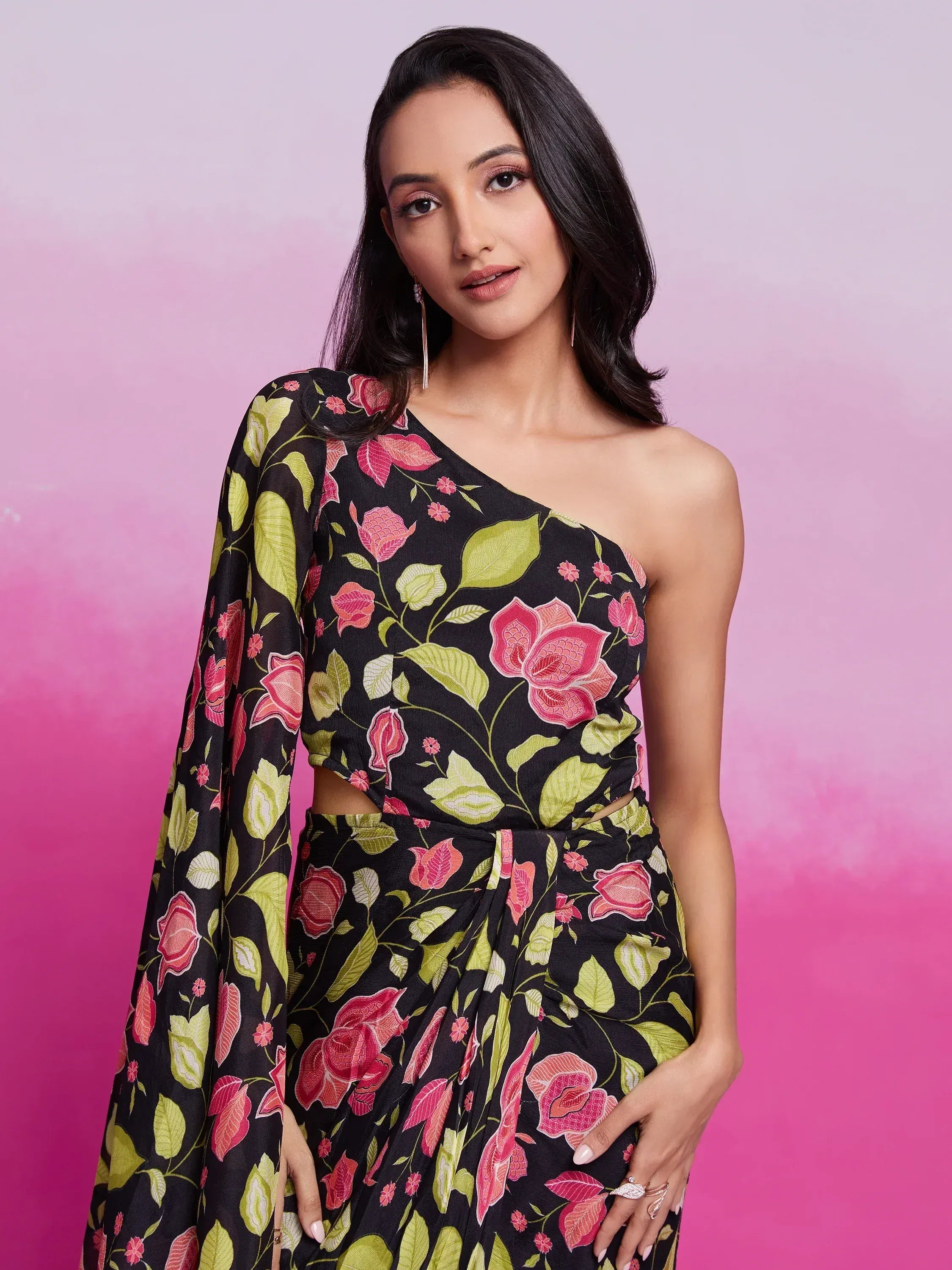 Black floral one-shoulder ethnic gown with pink and green print, perfect for Indian occasions