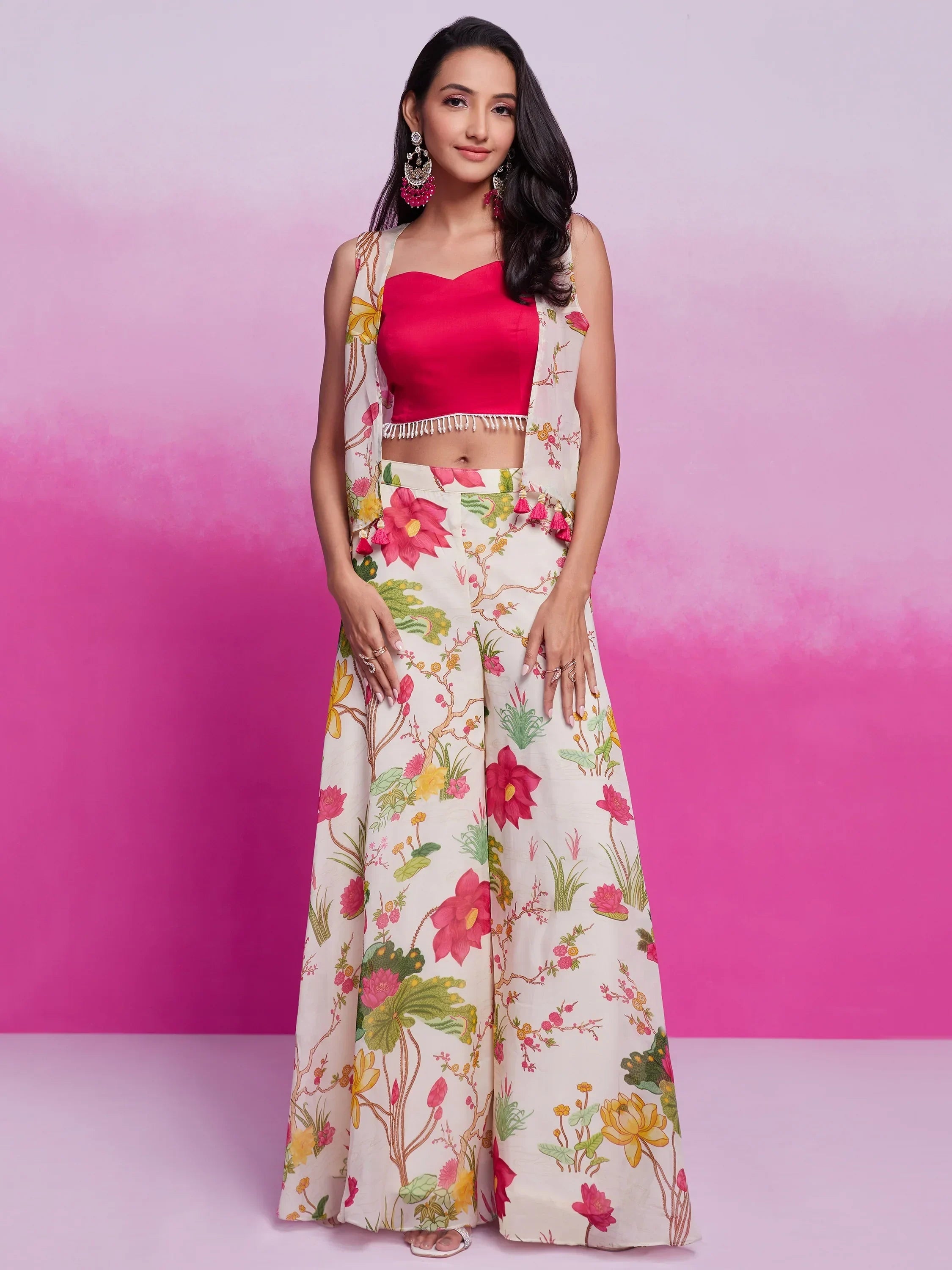 Woman in pink crop top with floral palazzo pants and matching jacket, ethnic wear fashion