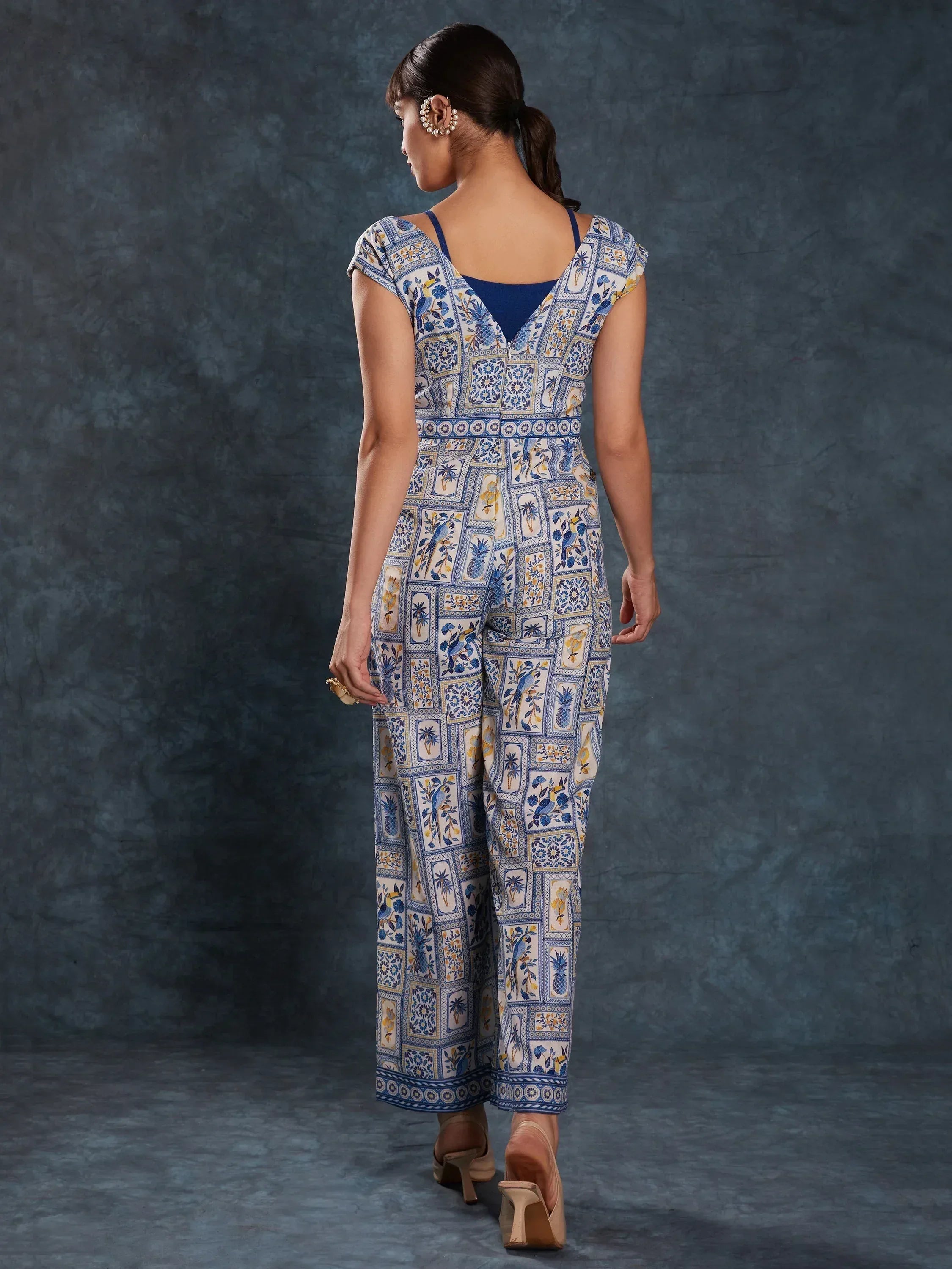 Blue and white printed ethnic jumpsuit with floral and bird motifs, back view