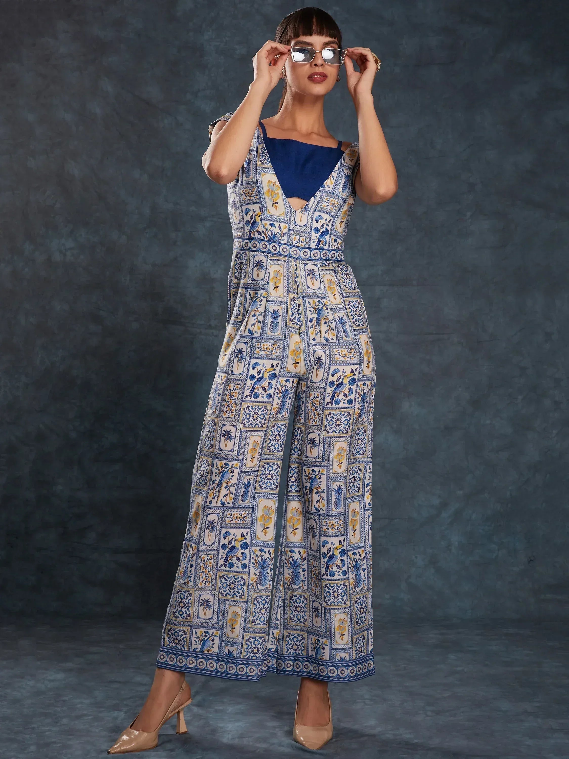 Blue and white printed ethnic gown with floral and bird motifs, perfect for Indian wear