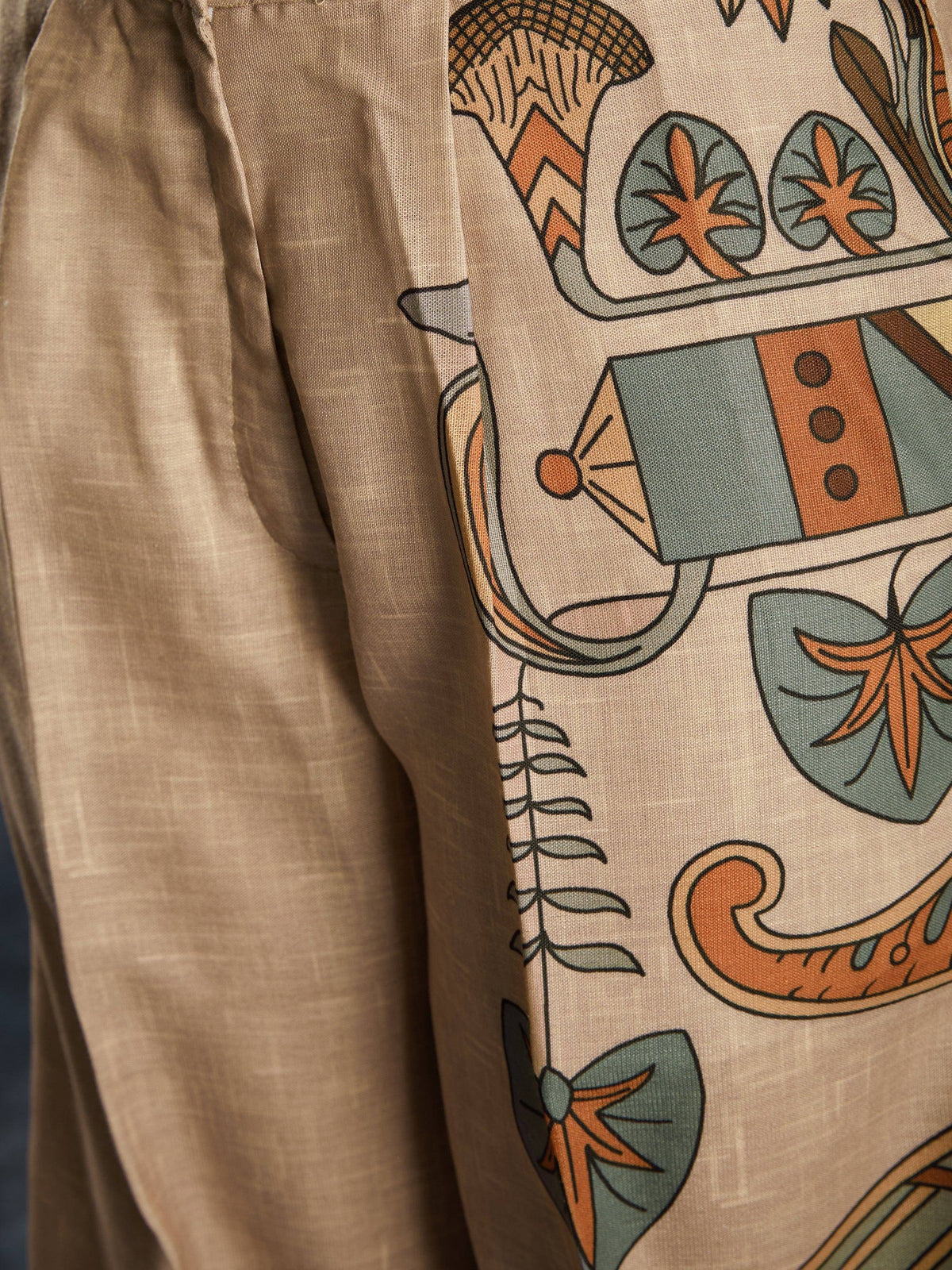 Beige ethnic kurta with vibrant botanical print, perfect for Indian wear and festive occasions.