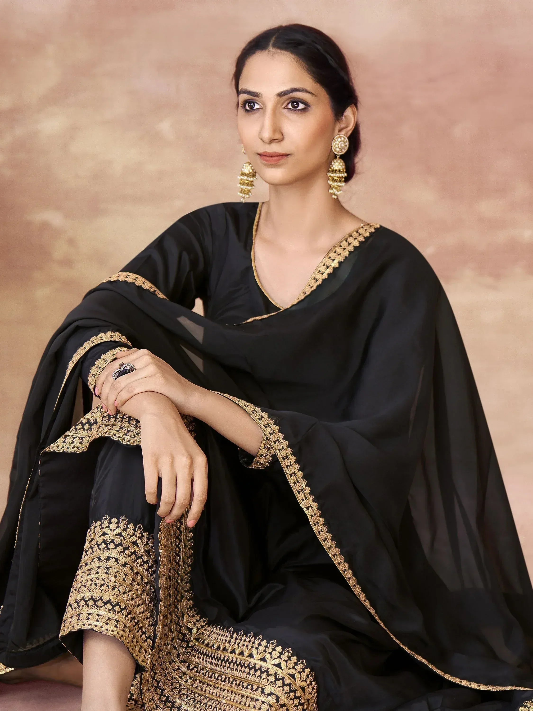 Black ethnic salwar kameez with gold embroidery, perfect for Indian festive occasions and parties.