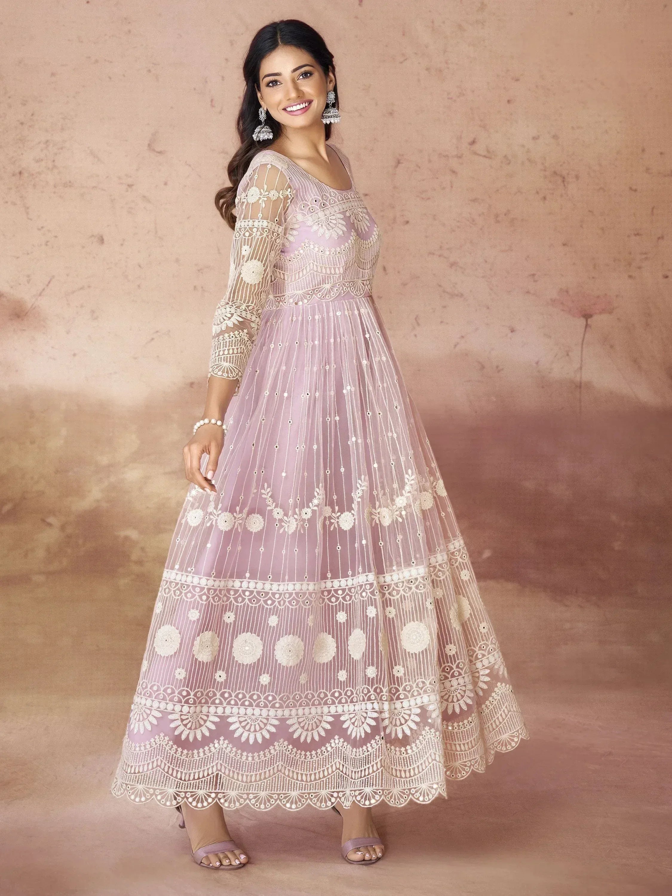 Elegant lavender ethnic gown with intricate white embroidery and sheer sleeves for festive occasions