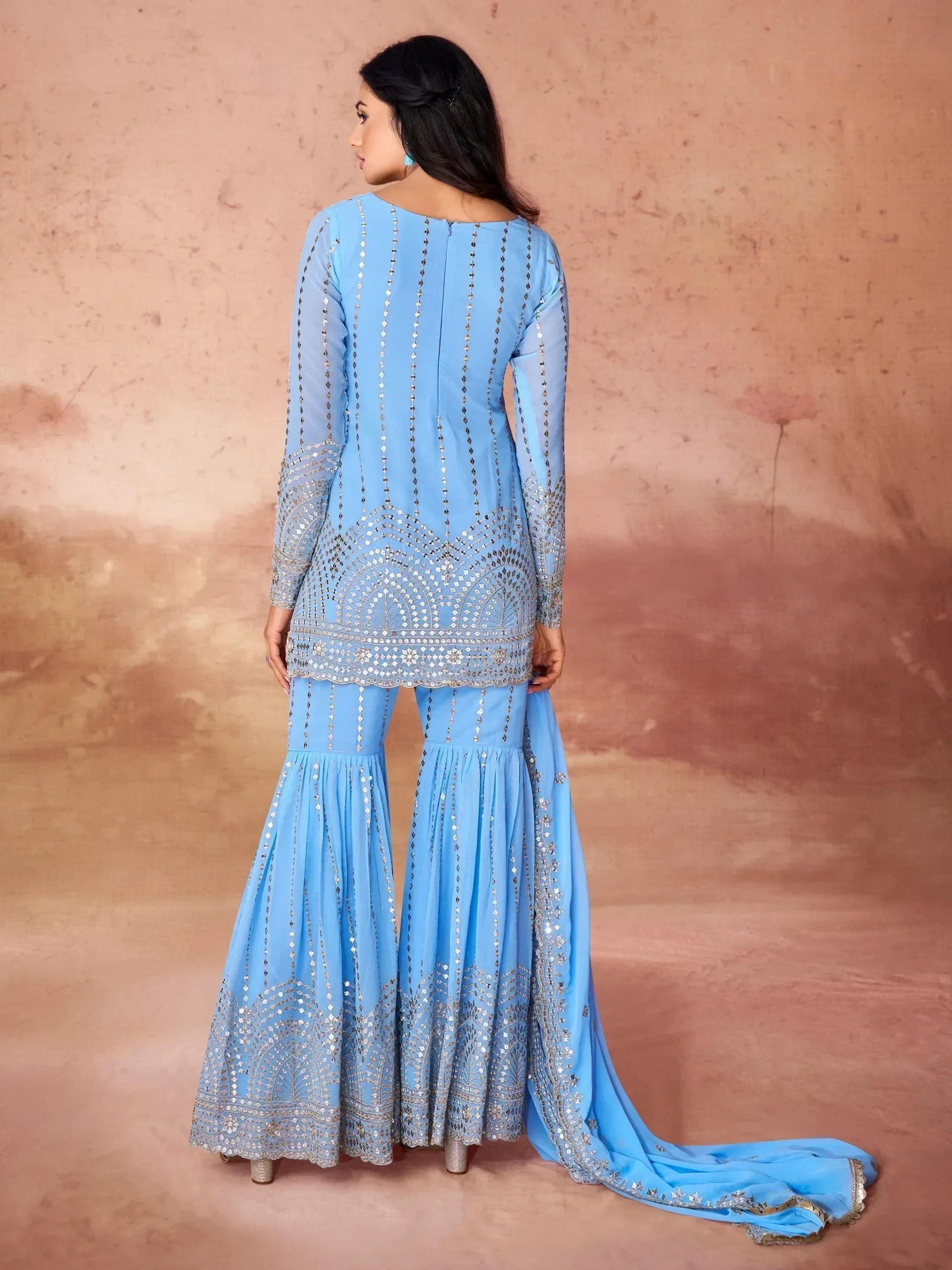 Light blue ethnic salwar kameez with mirror work and flared pants, perfect for Indian occasions