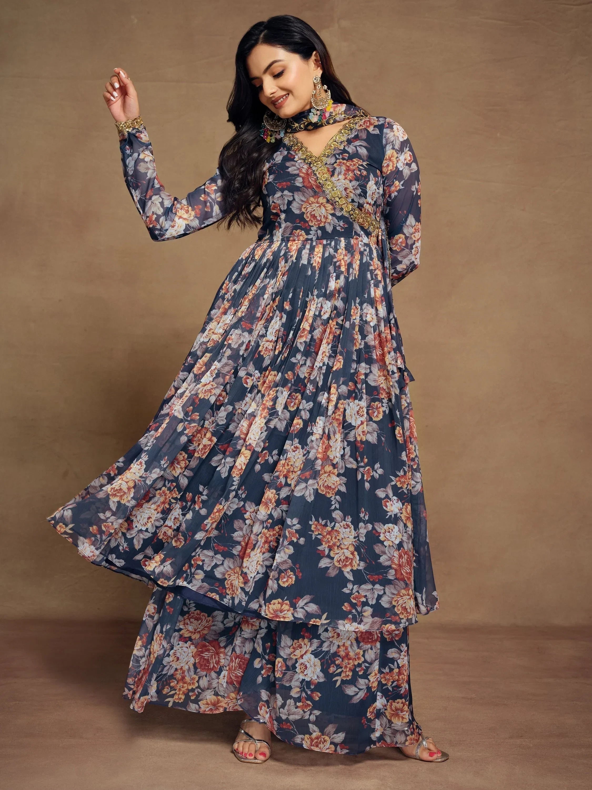 Woman wearing navy blue floral printed ethnic gown with long sleeves and flared skirt