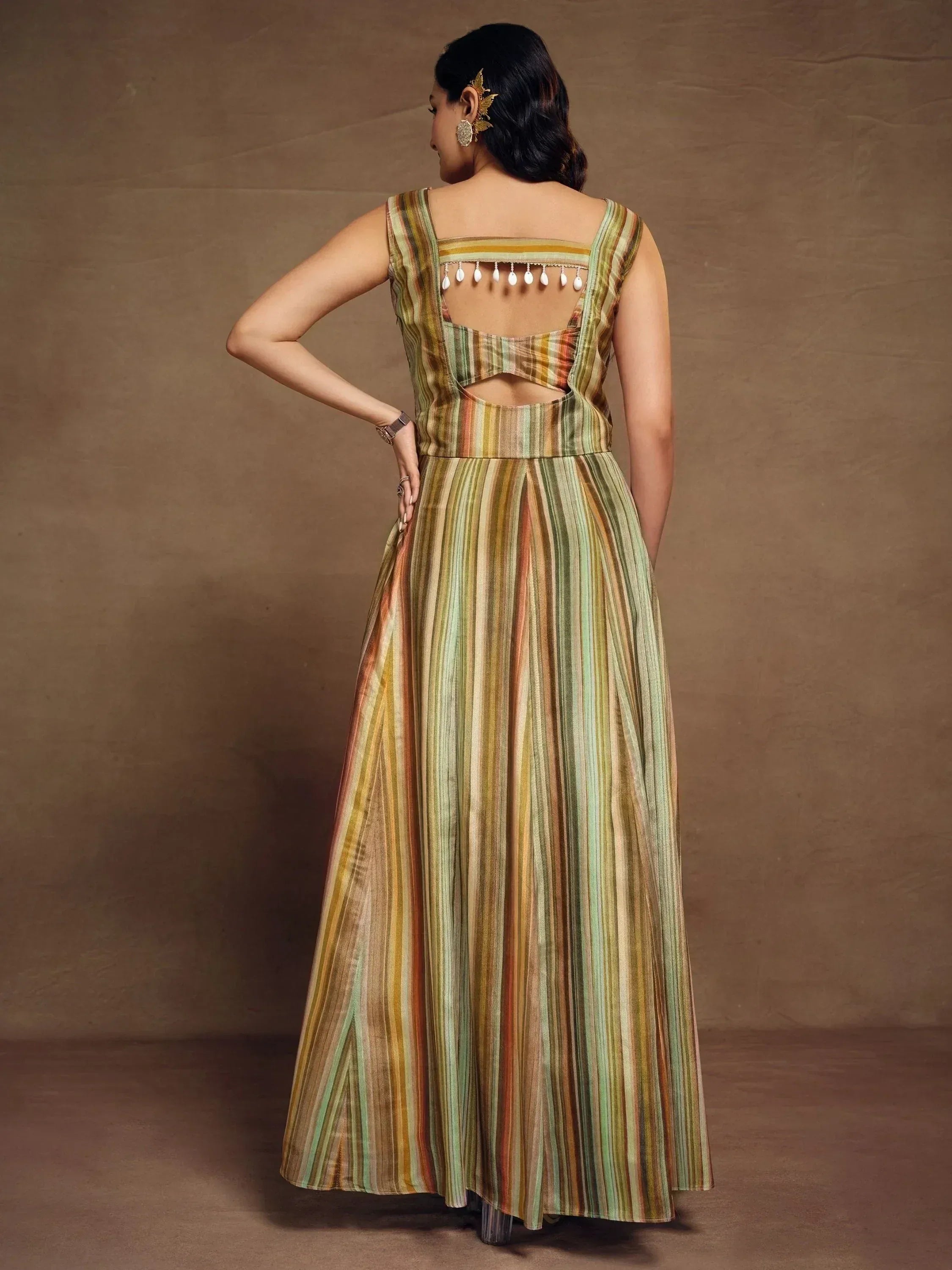 Striped ethnic gown with back cutout and tassels, perfect for Indian occasions