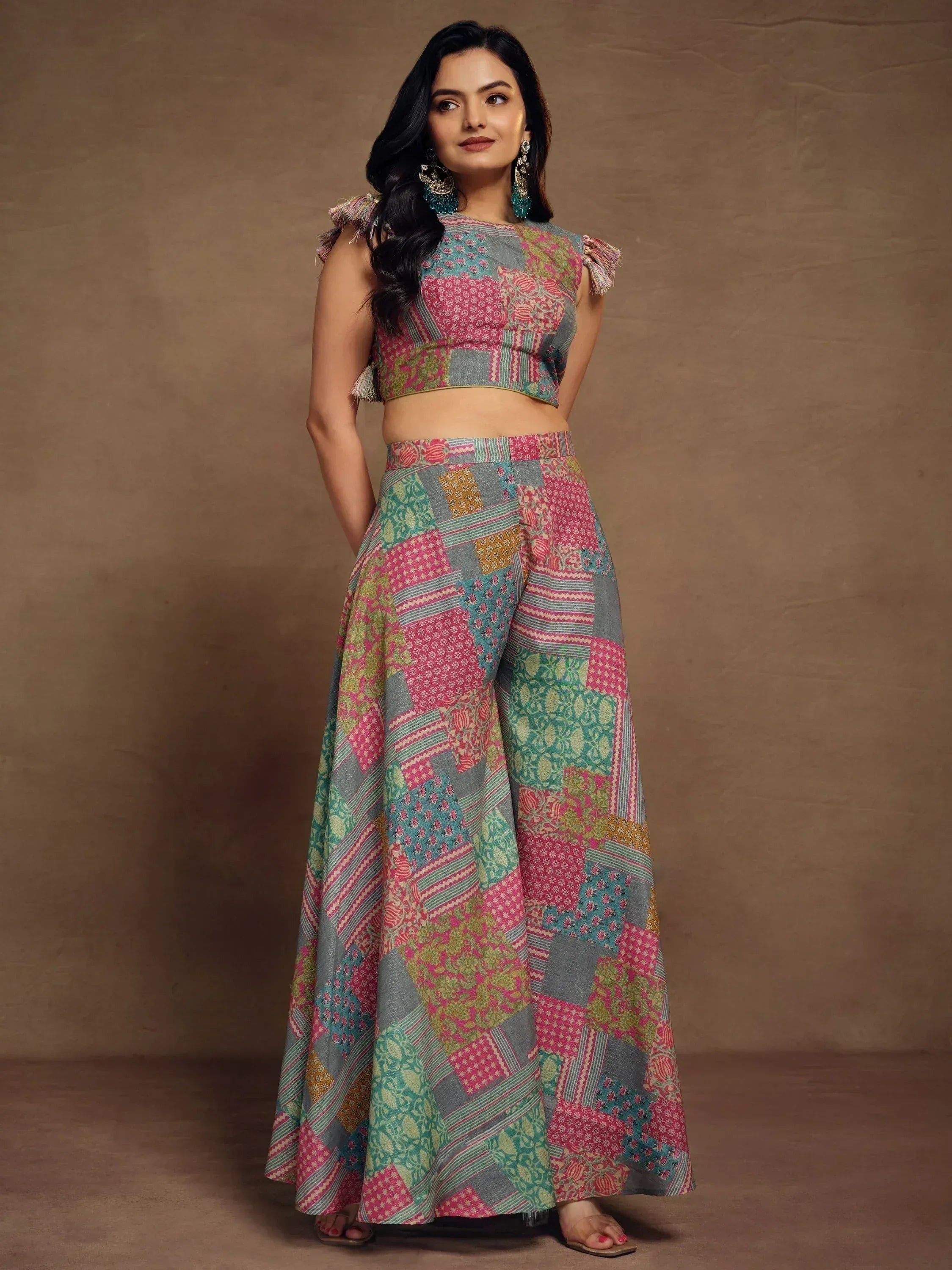 Woman in colorful patchwork lehenga choli with tassel sleeves, Indian ethnic wear