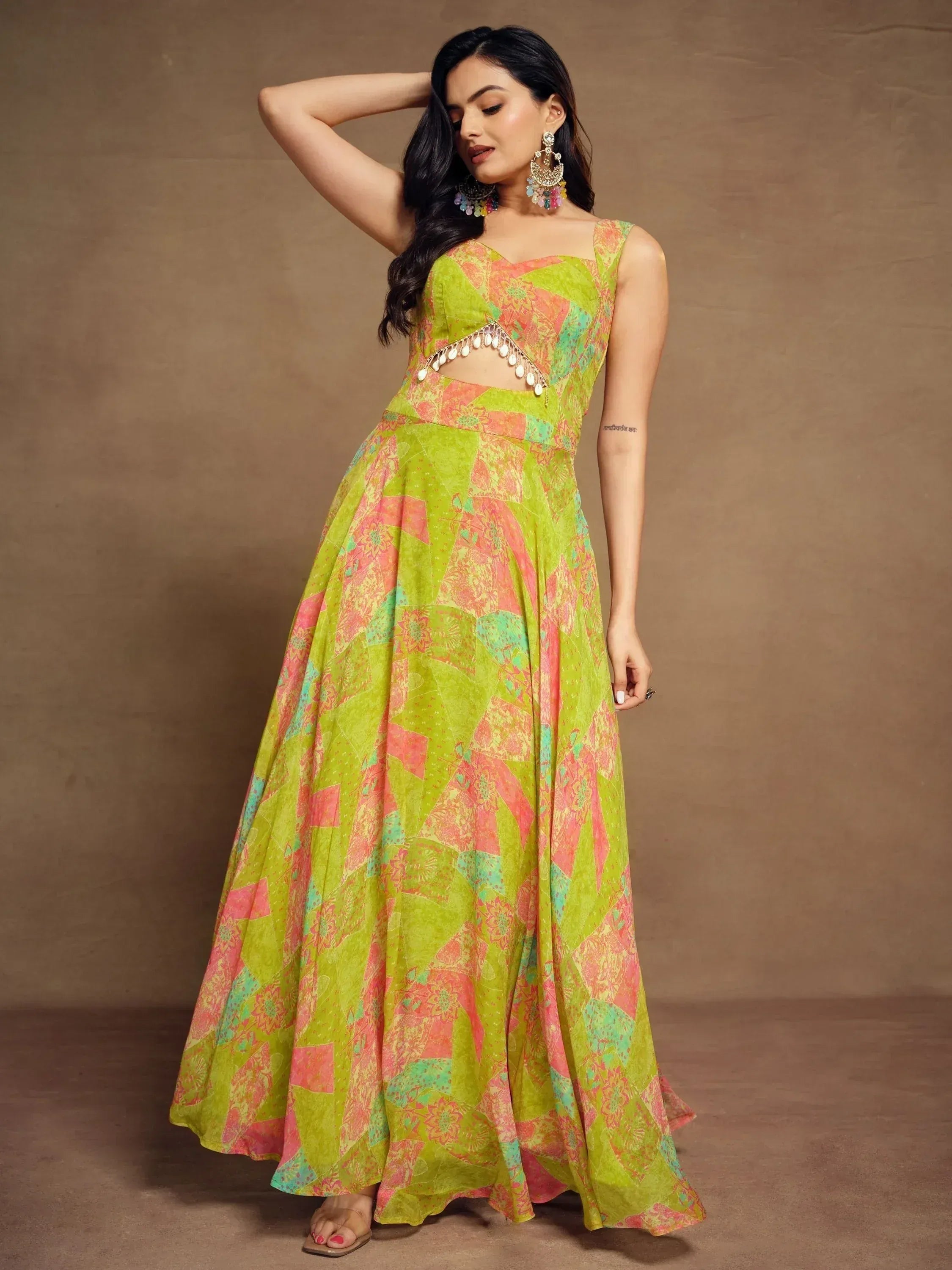 Vibrant green and pink printed ethnic gown with cutout detail and tassel embellishment