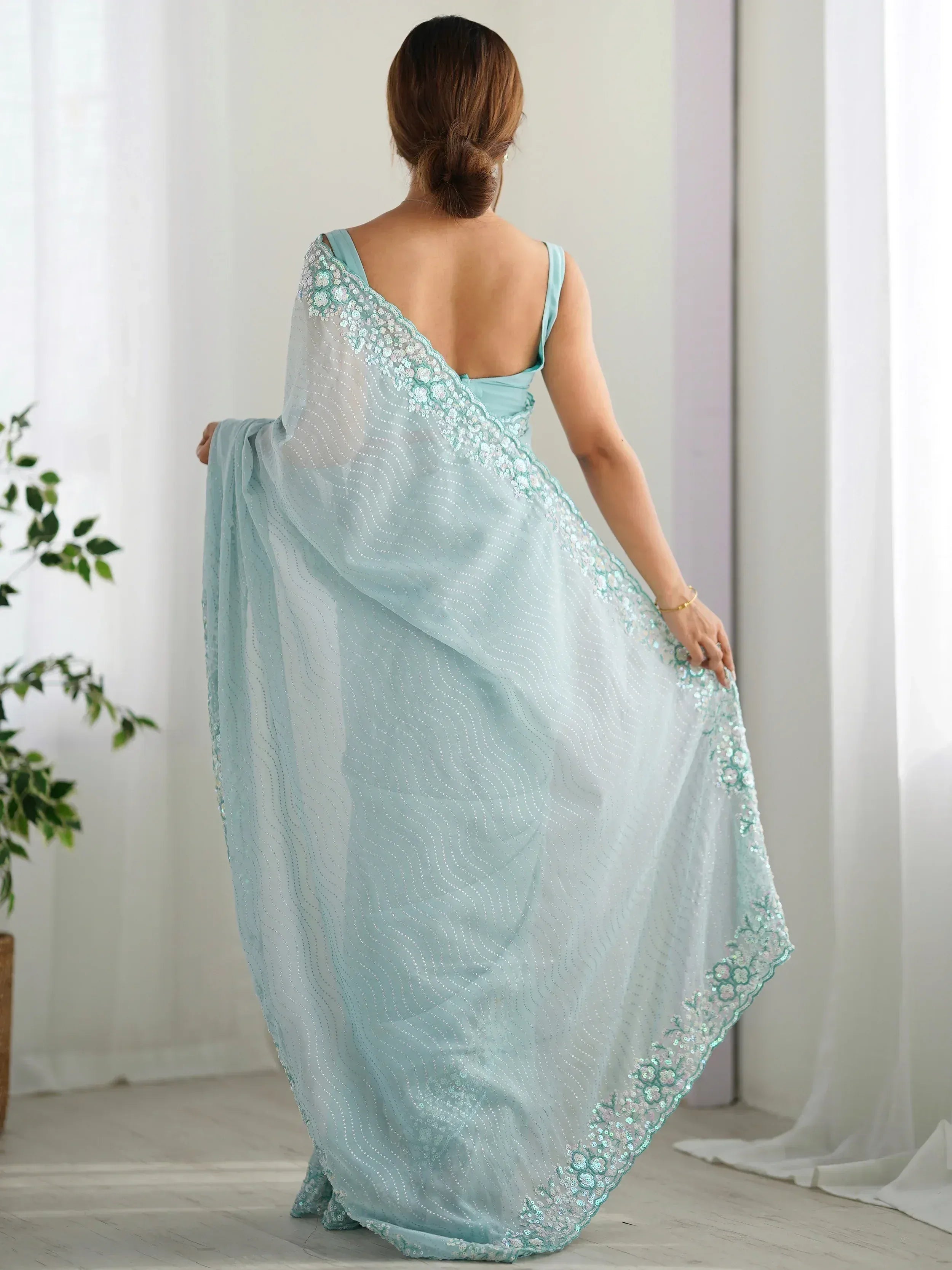 Mint green designer saree with sequin embroidery and backless blouse, ethnic wear for women