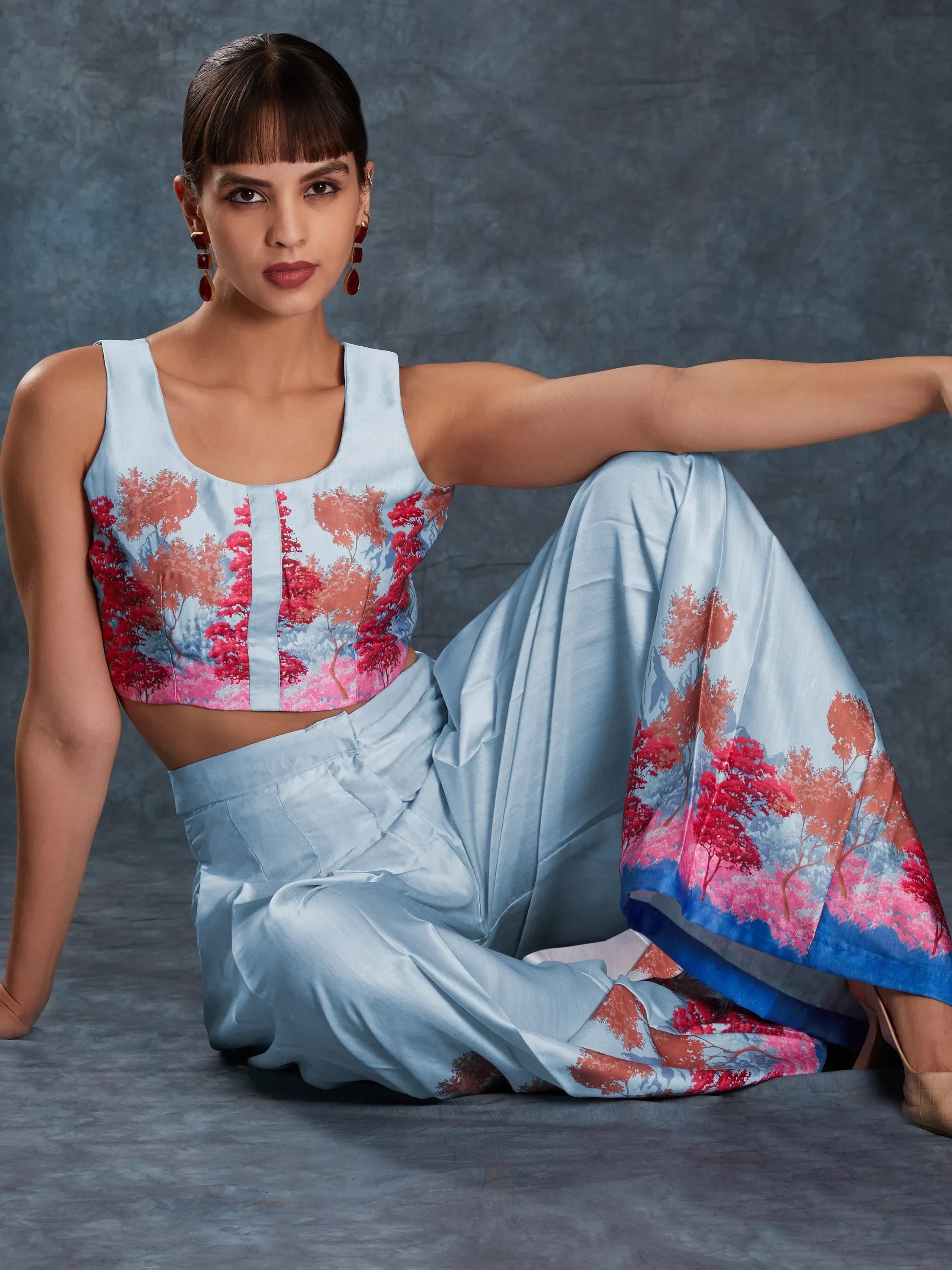 Woman in light blue floral crop top and wide leg pants, Indian ethnic wear fashion