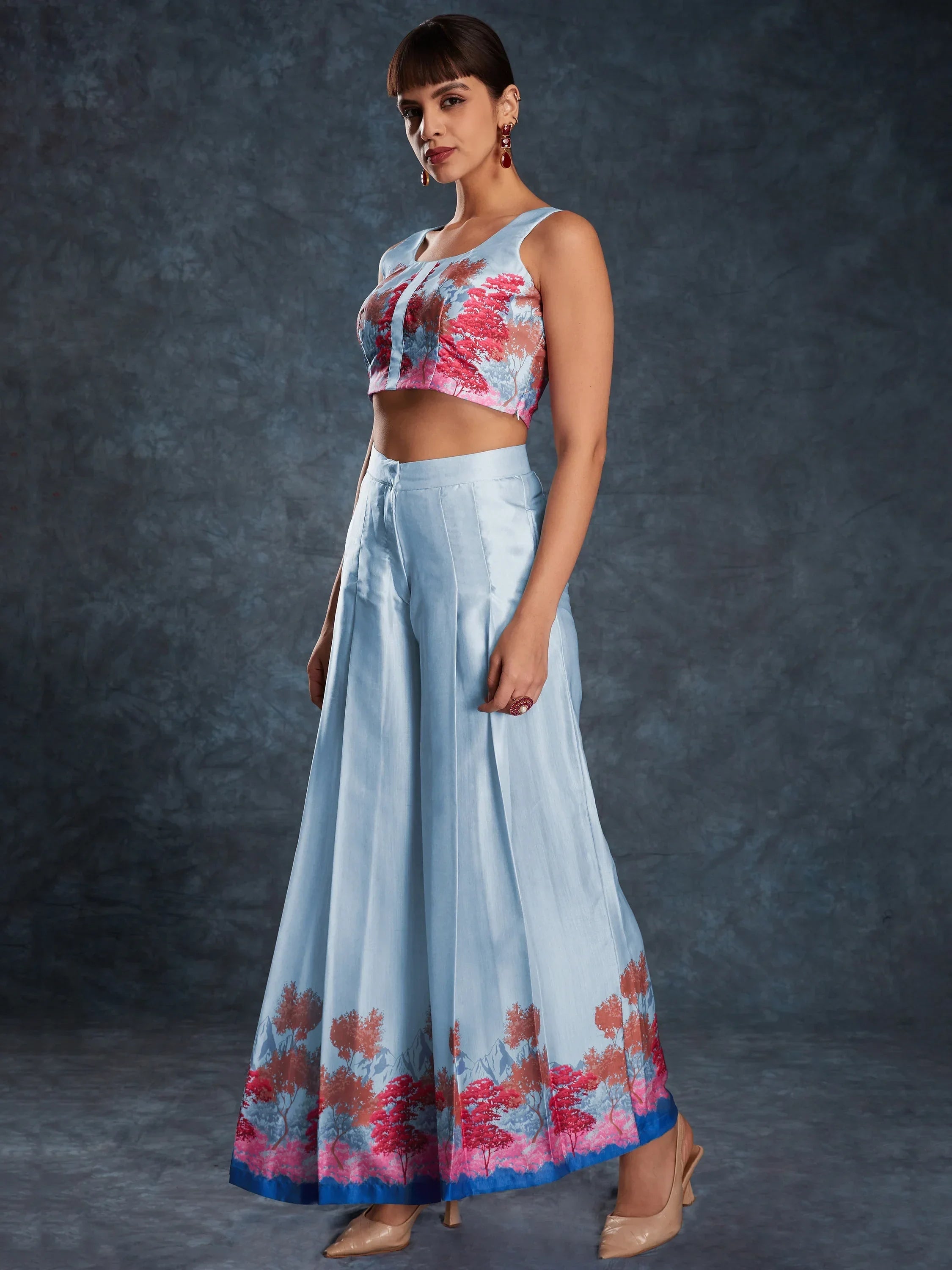 Woman in a light blue printed crop top and flared palazzo pants, Indian ethnic wear
