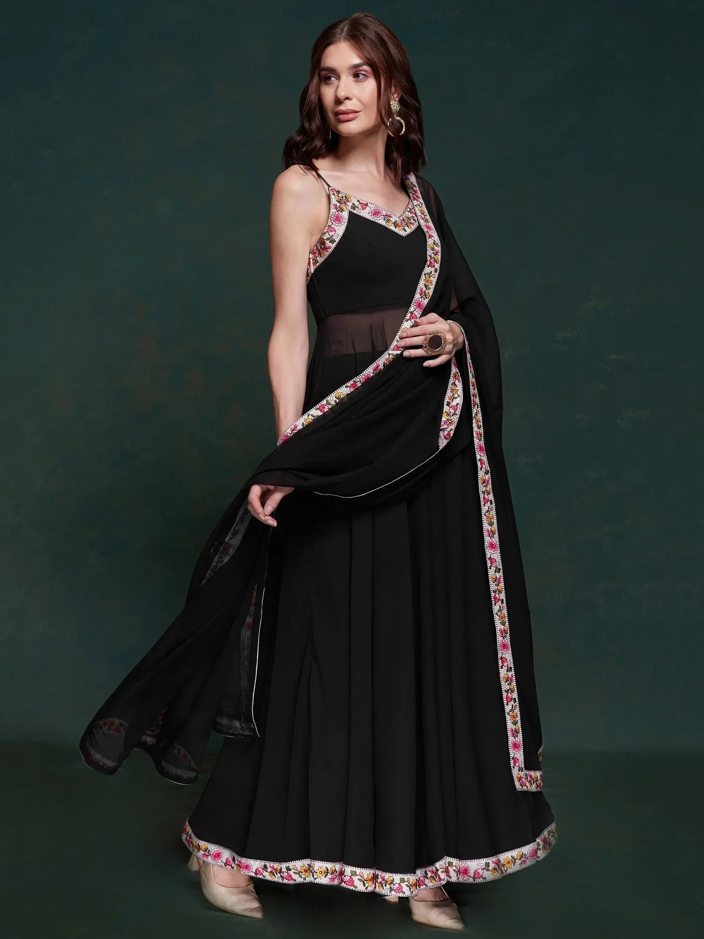 Black ethnic gown with floral embroidery, perfect for Indian occasions and parties.