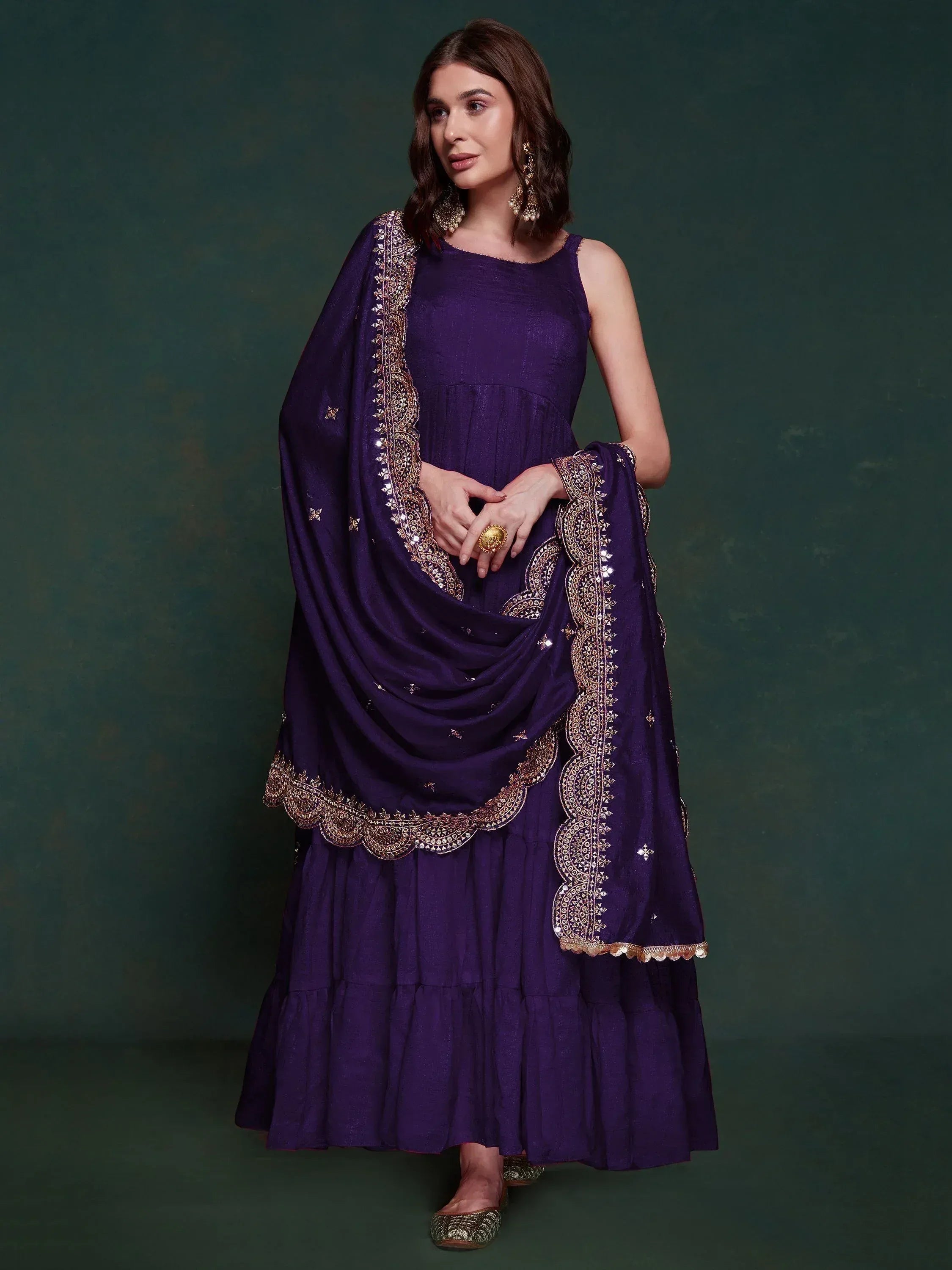 Purple ethnic gown with gold embroidery and dupatta, perfect for Indian occasions