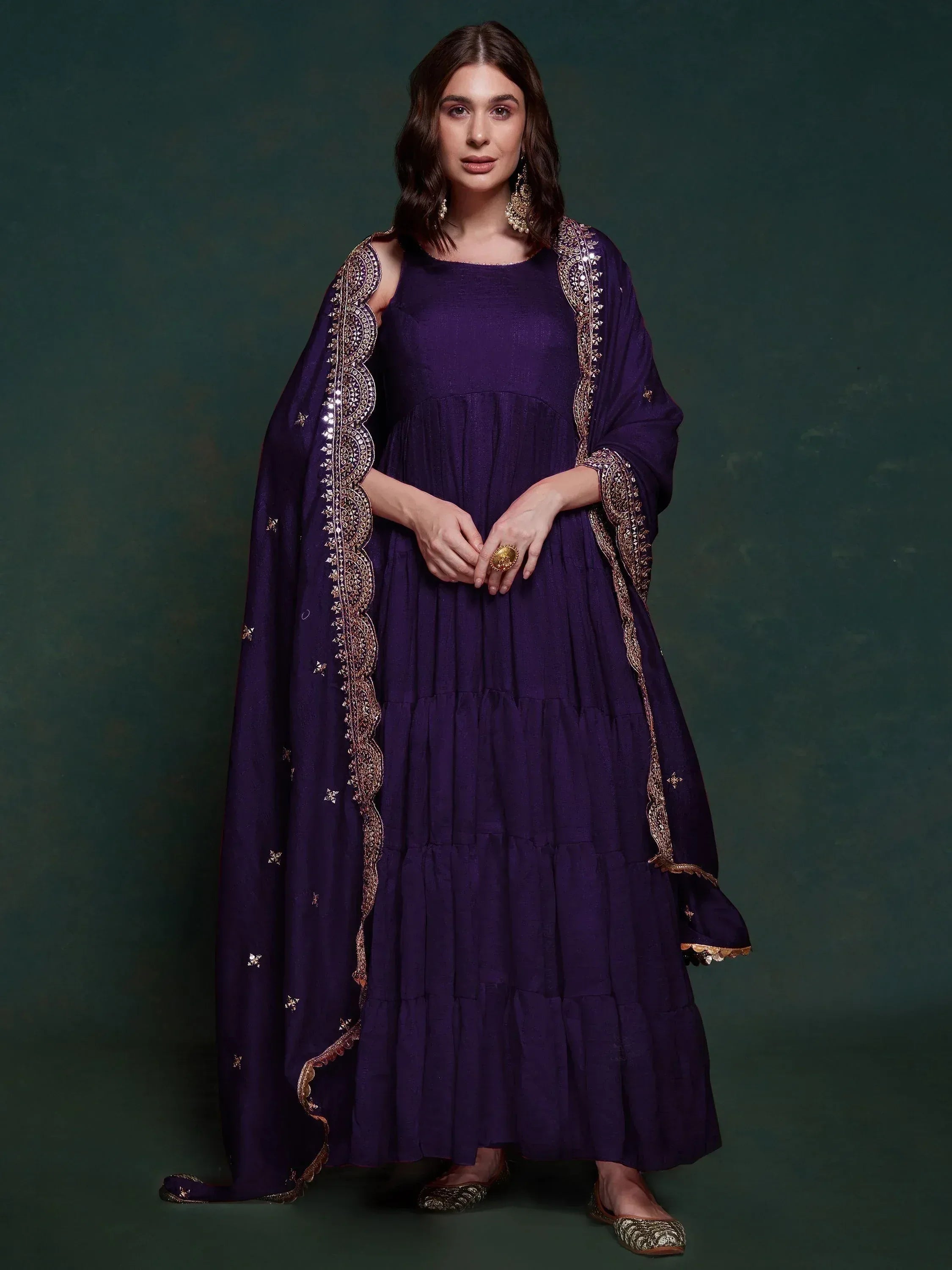 Purple ethnic gown with gold embroidery and matching dupatta, perfect for Indian festive occasions