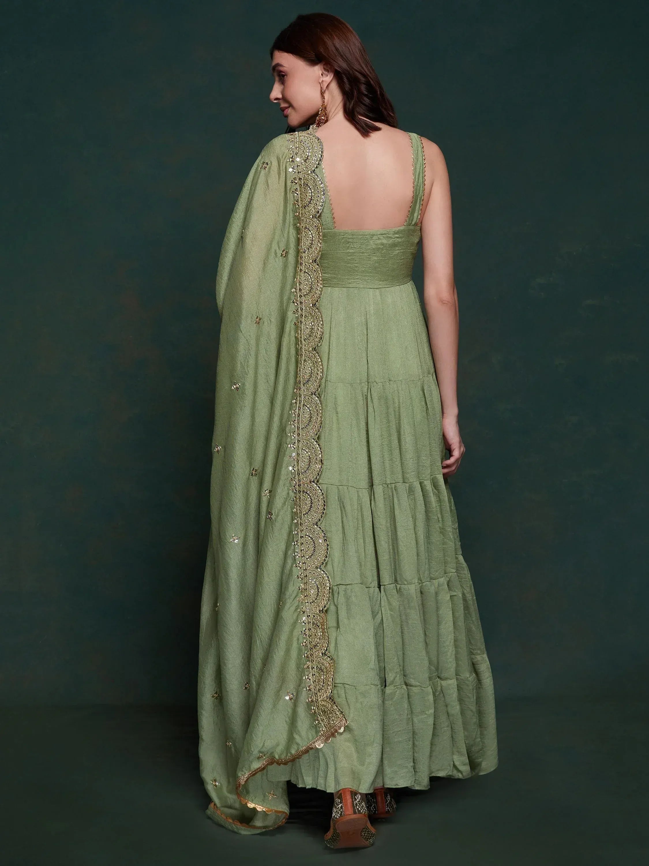 Green ethnic gown with gold embroidery and dupatta, back view