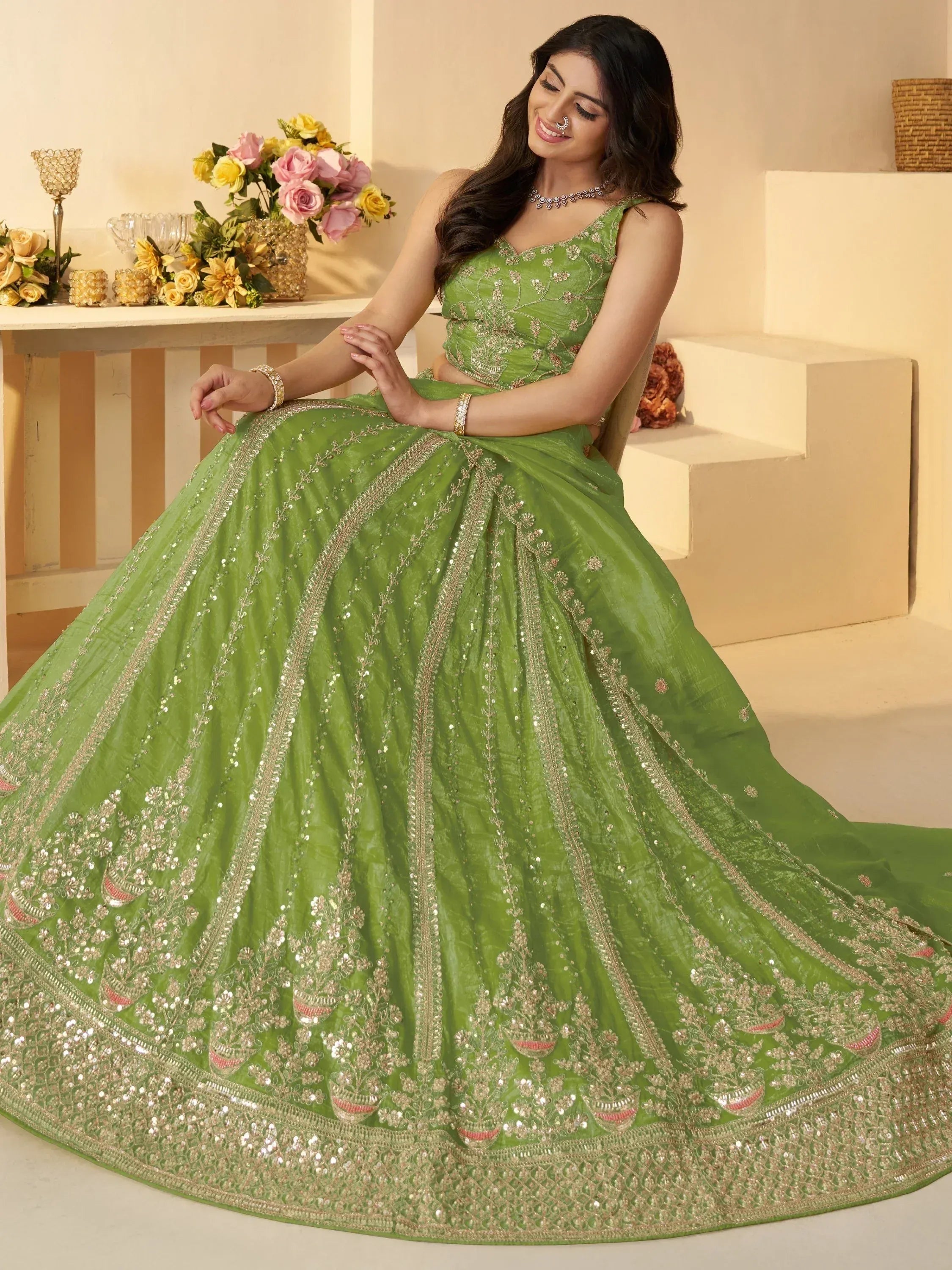 Green embroidered lehenga choli with gold detailing, perfect for Indian ethnic wear events