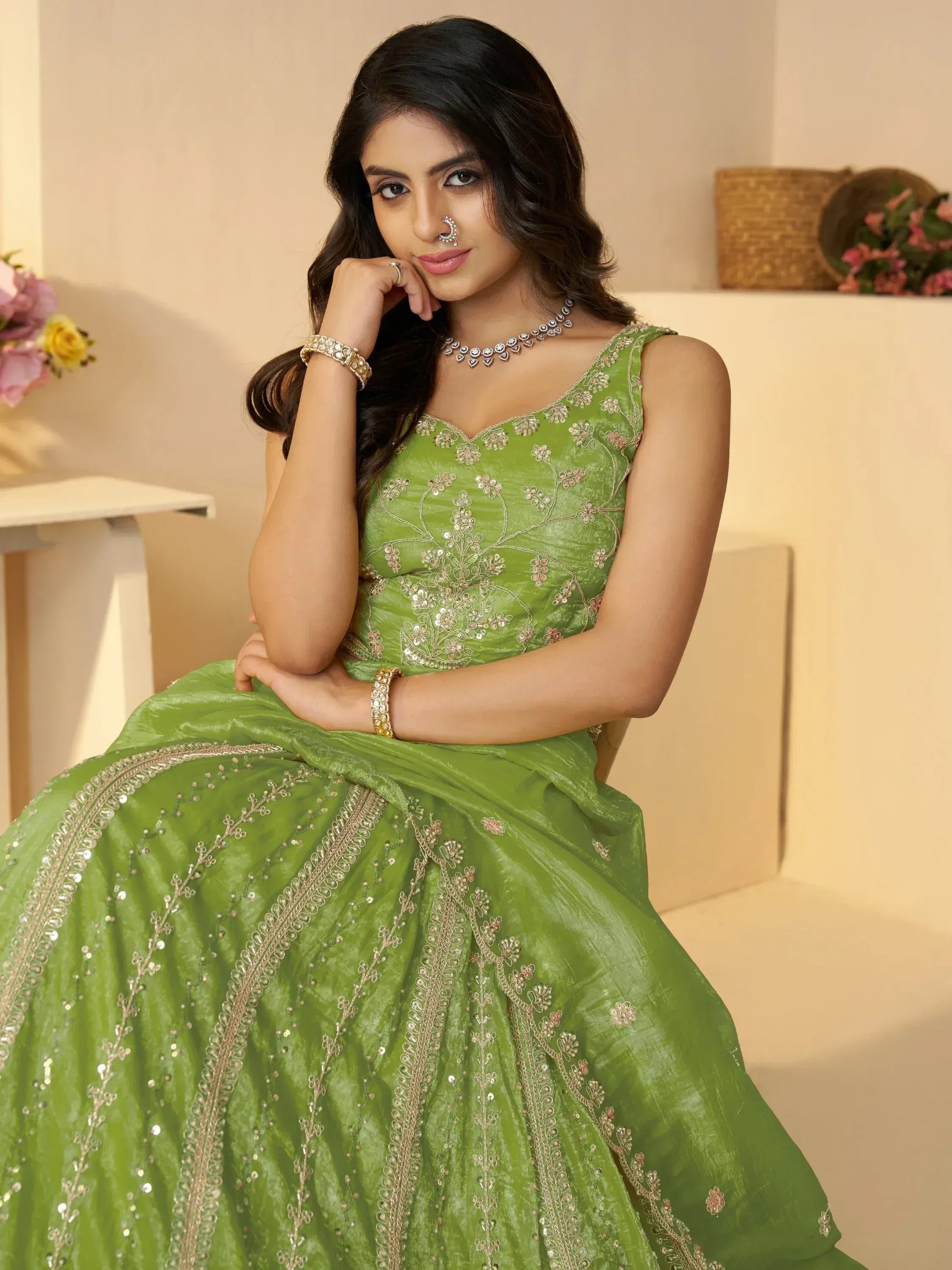 Green embroidered lehenga choli with floral sequin work, perfect for Indian ethnic wear occasions.