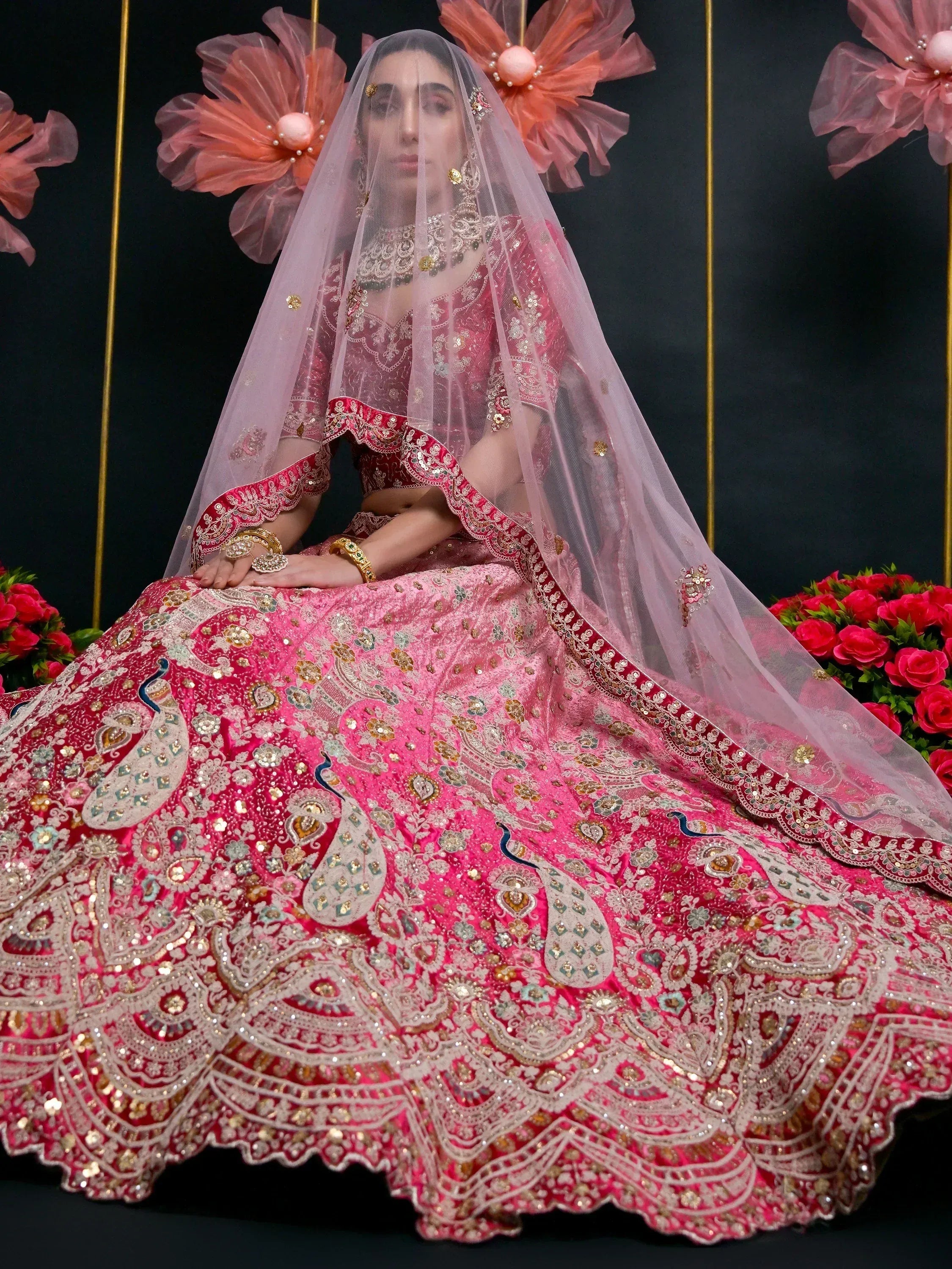 Pink embroidered lehenga choli with peacock motifs and sheer dupatta, Indian ethnic bridal wear
