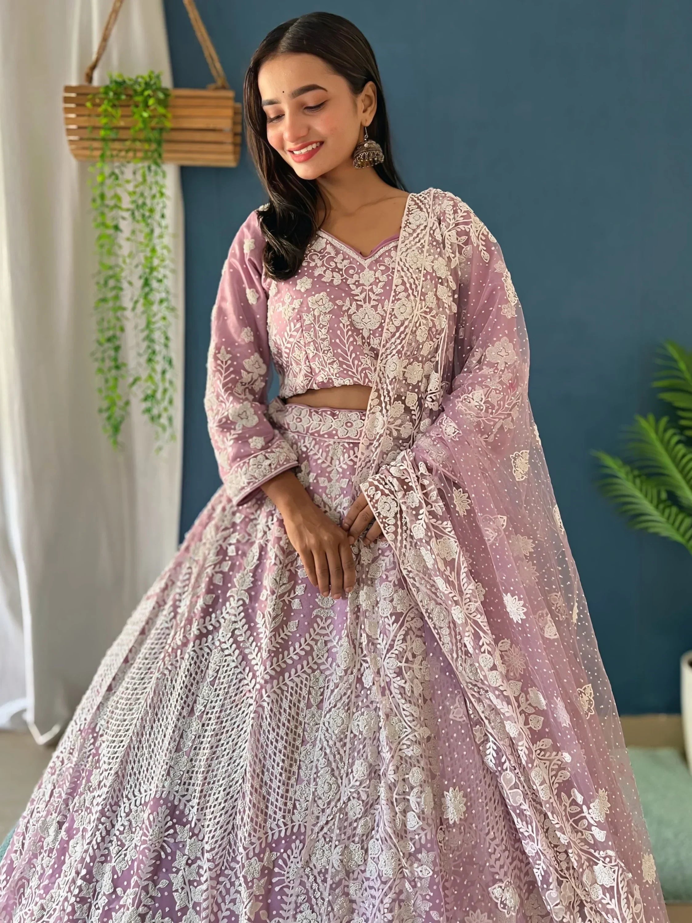 Pink embroidered lehenga choli with floral lace and sheer dupatta, perfect for Indian ethnic occasions