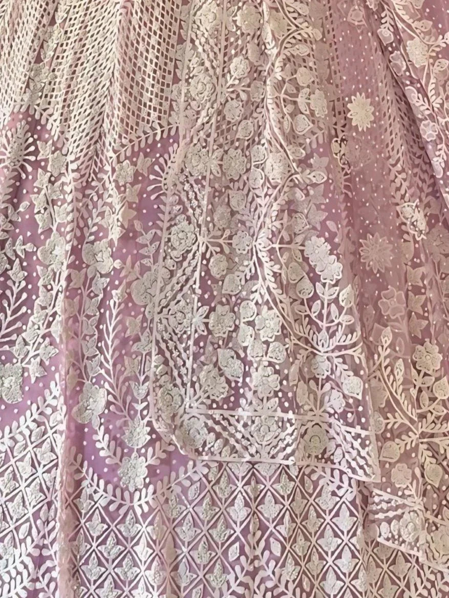 Pink floral embroidered lehenga with intricate gold work and sheer net overlay