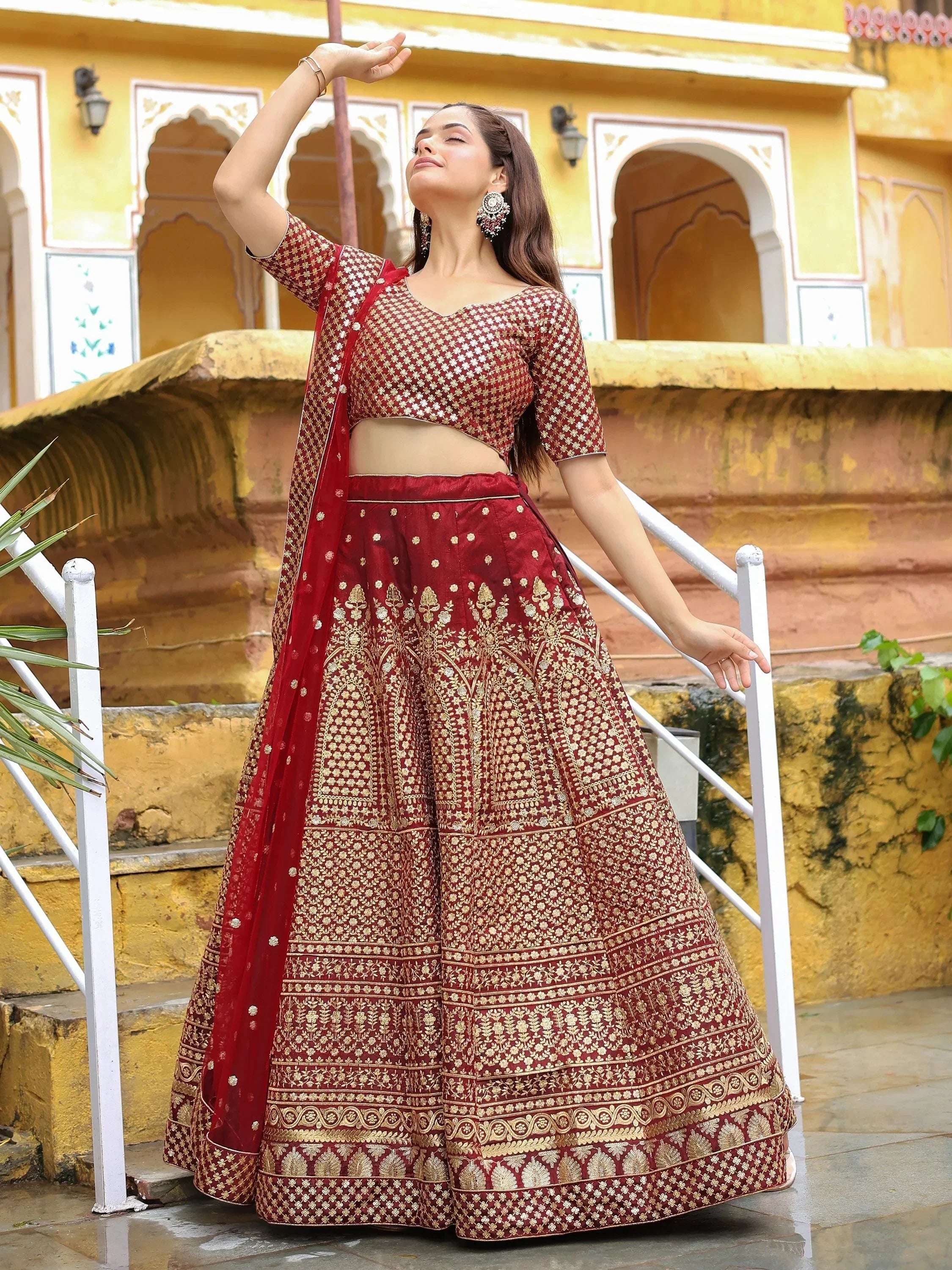 Maroon embroidered lehenga choli with gold detailing, perfect for Indian ethnic wear occasions