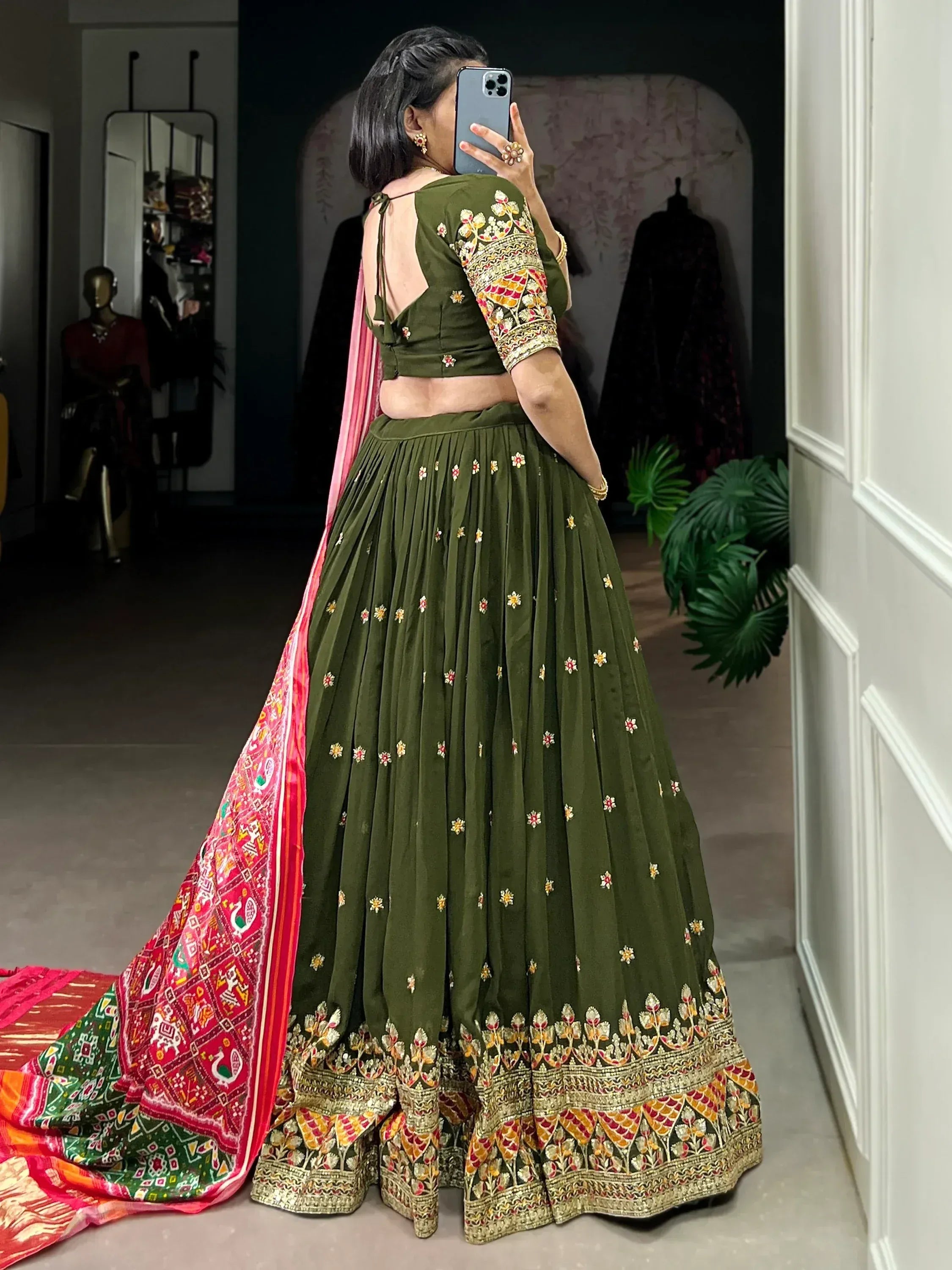 Olive green embroidered lehenga choli with pink dupatta, perfect for Indian ethnic wear occasions.