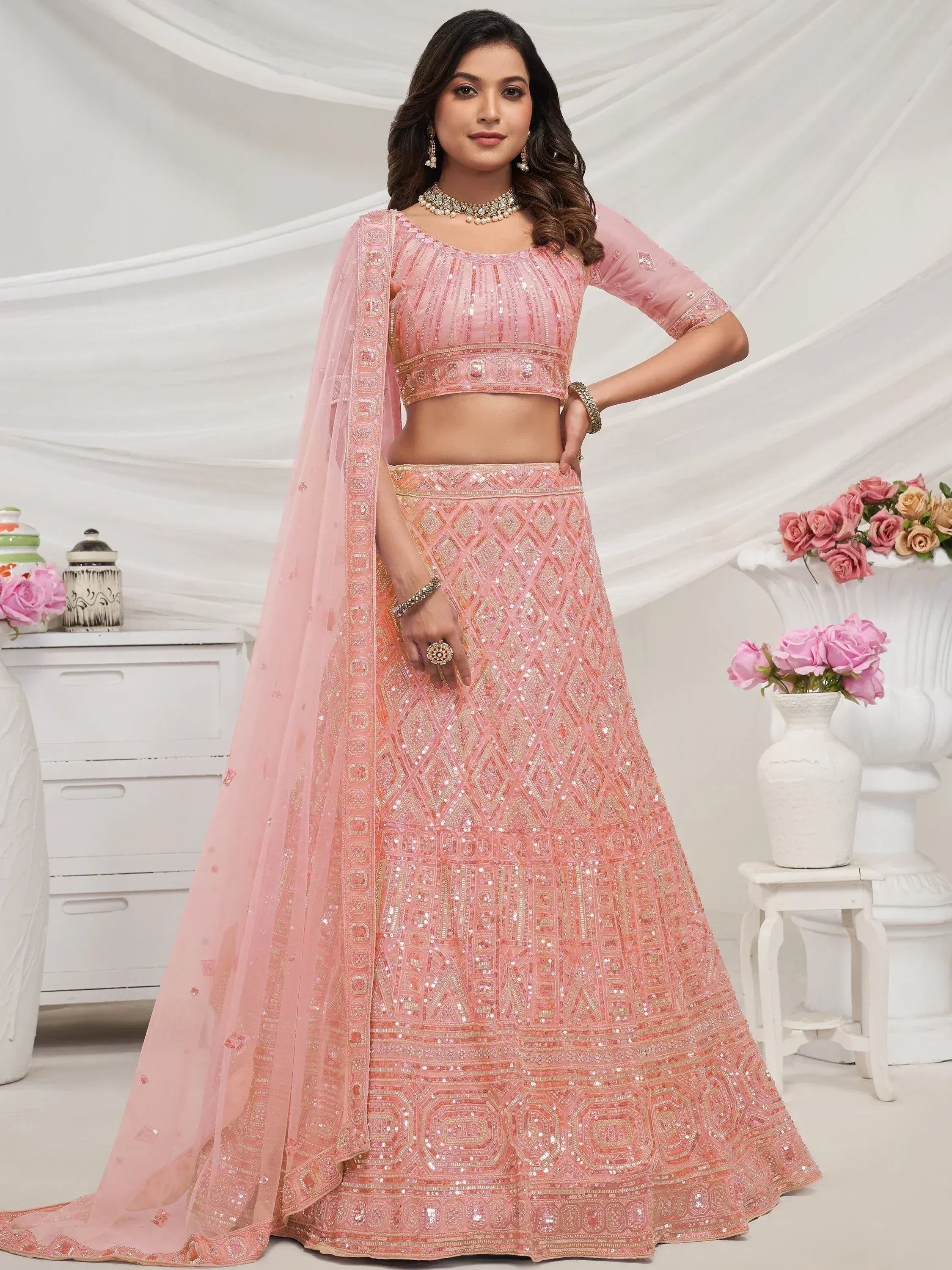 Pink embroidered lehenga choli with sequin work, perfect for Indian weddings and festive occasions