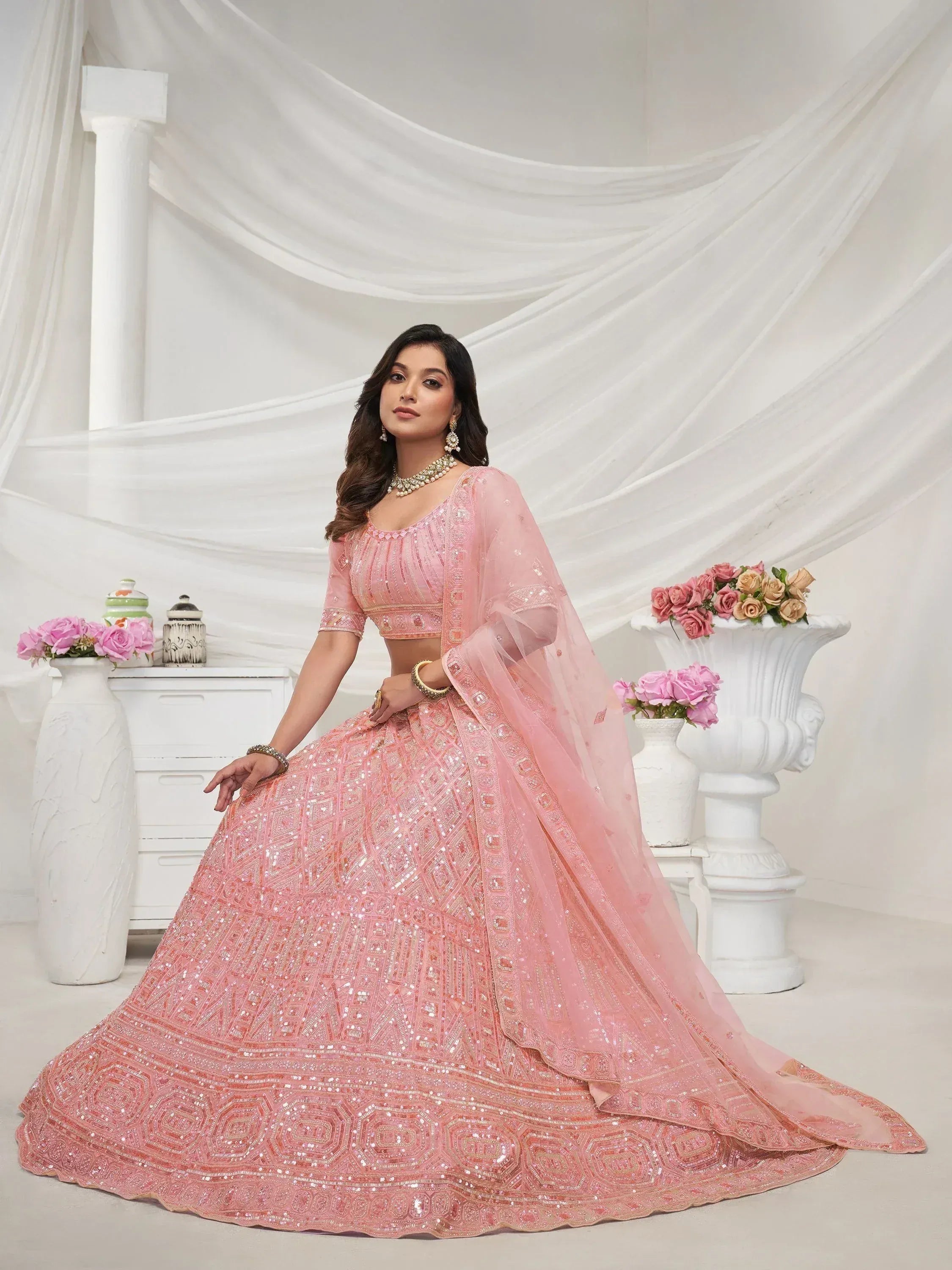Pink sequined lehenga choli with intricate embroidery, perfect for Indian weddings and festive occasions