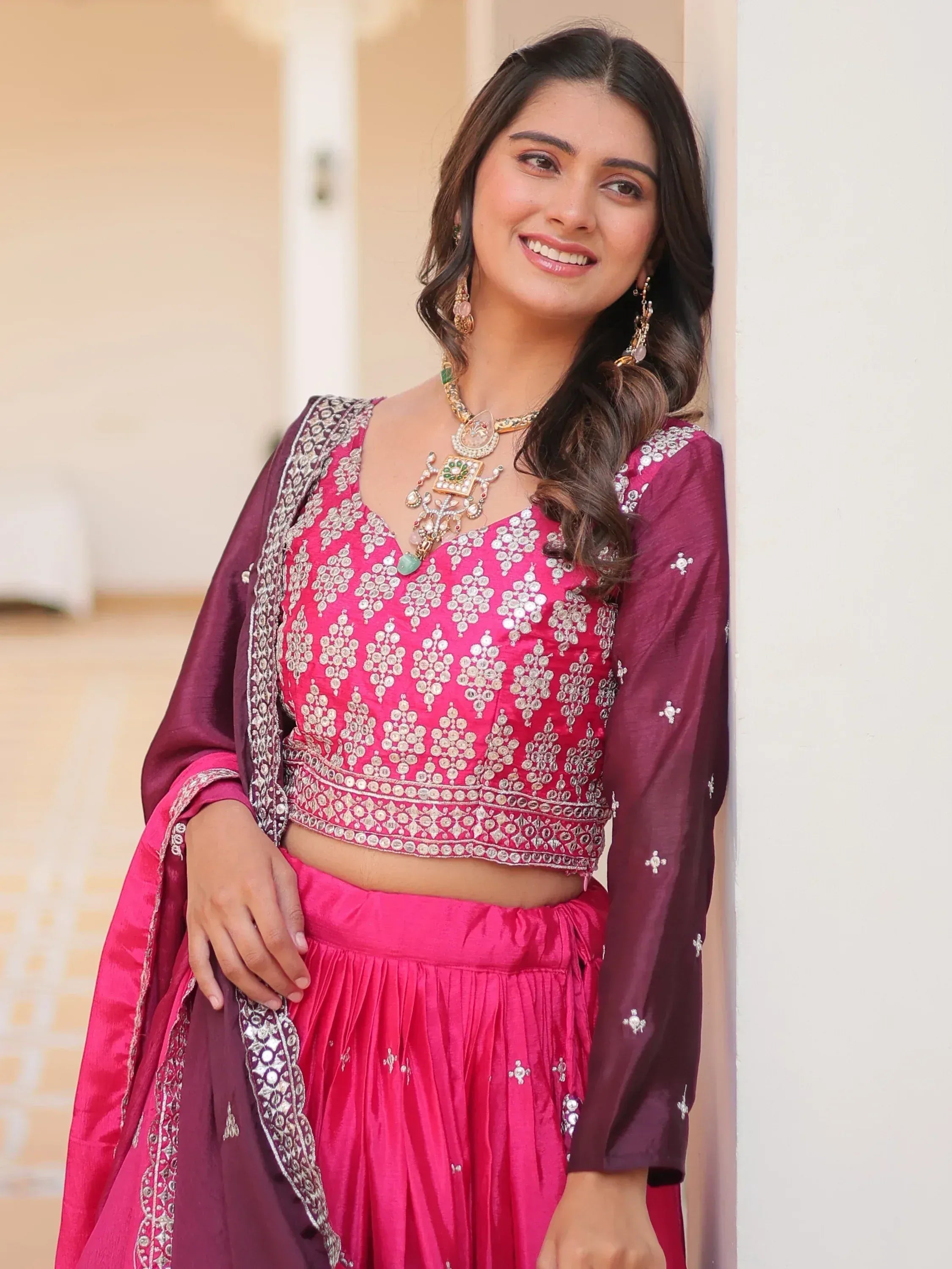 Pink and maroon designer lehenga choli with mirror work, perfect for Indian ethnic wear occasions