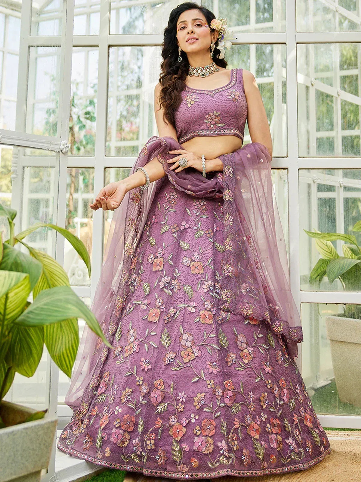 Purple floral embroidered lehenga choli with net dupatta, perfect for Indian weddings and festive occasions