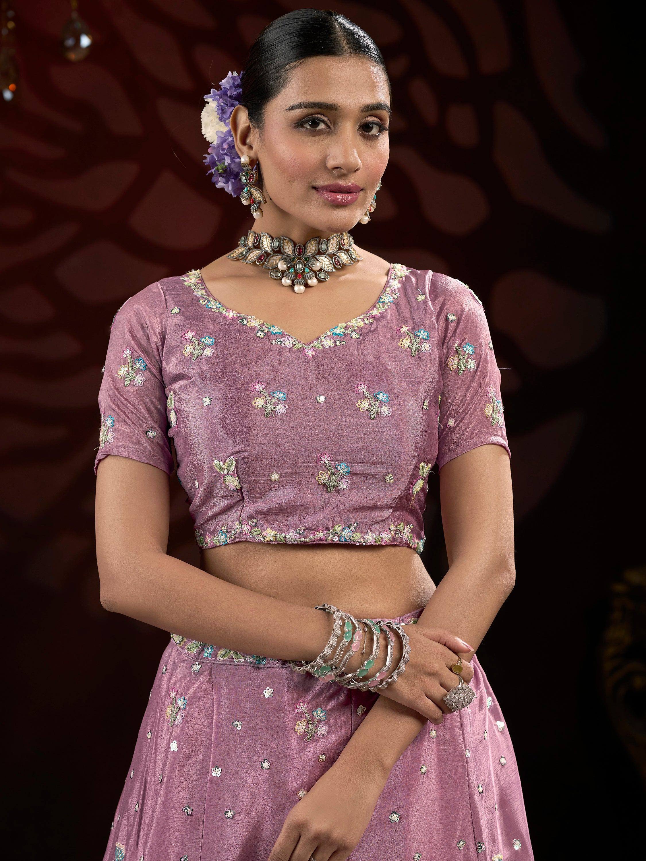 Pink floral embroidered lehenga choli with matching jewelry for Indian ethnic wear