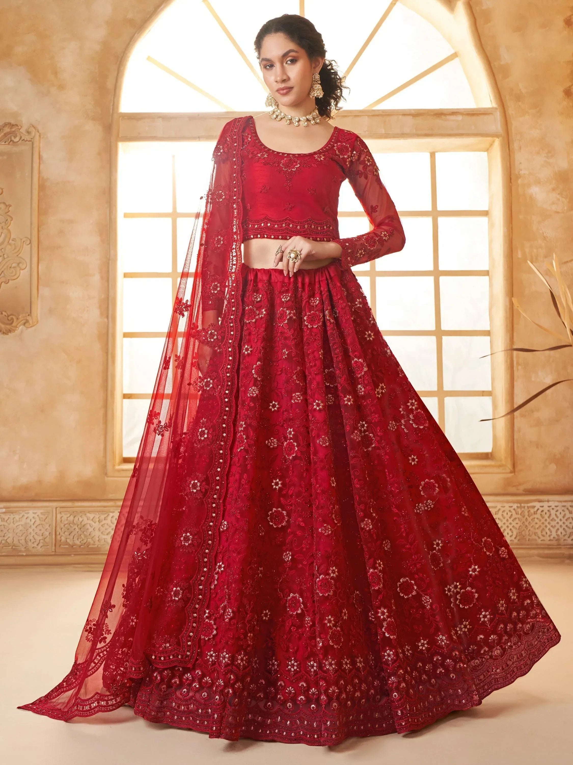 Red embroidered lehenga choli with sheer dupatta, perfect for Indian weddings and festive occasions
