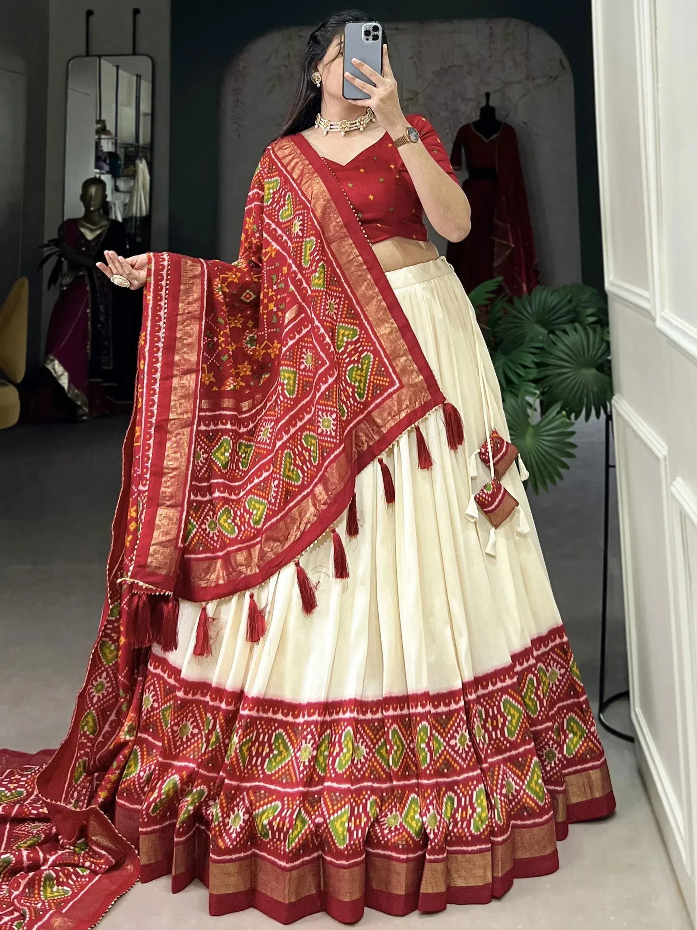 Red and cream ethnic lehenga choli with printed dupatta, perfect for Indian weddings and festive occasions