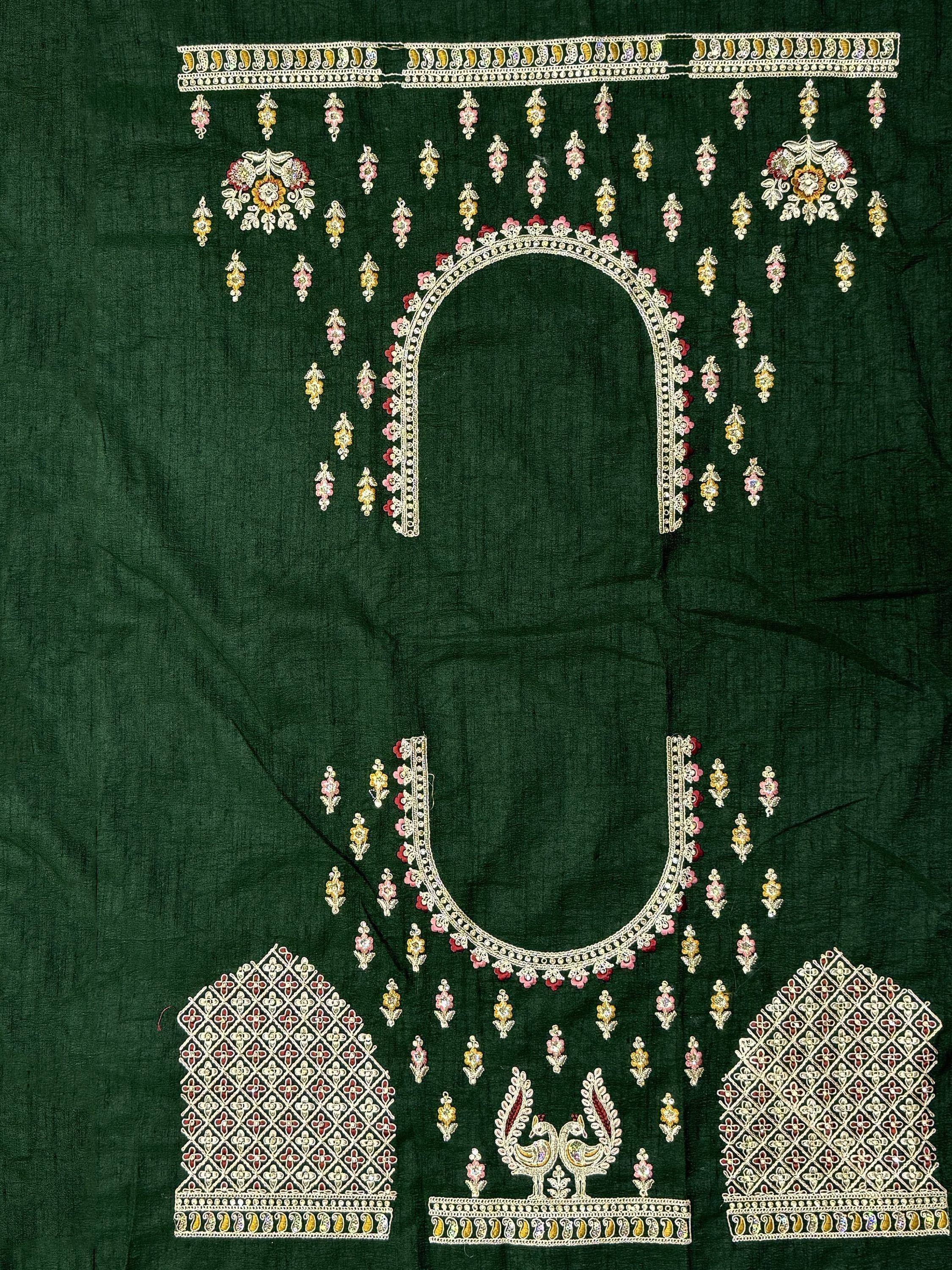 Emerald green ethnic blouse with intricate floral and peacock embroidery, perfect for designer lehenga choli.