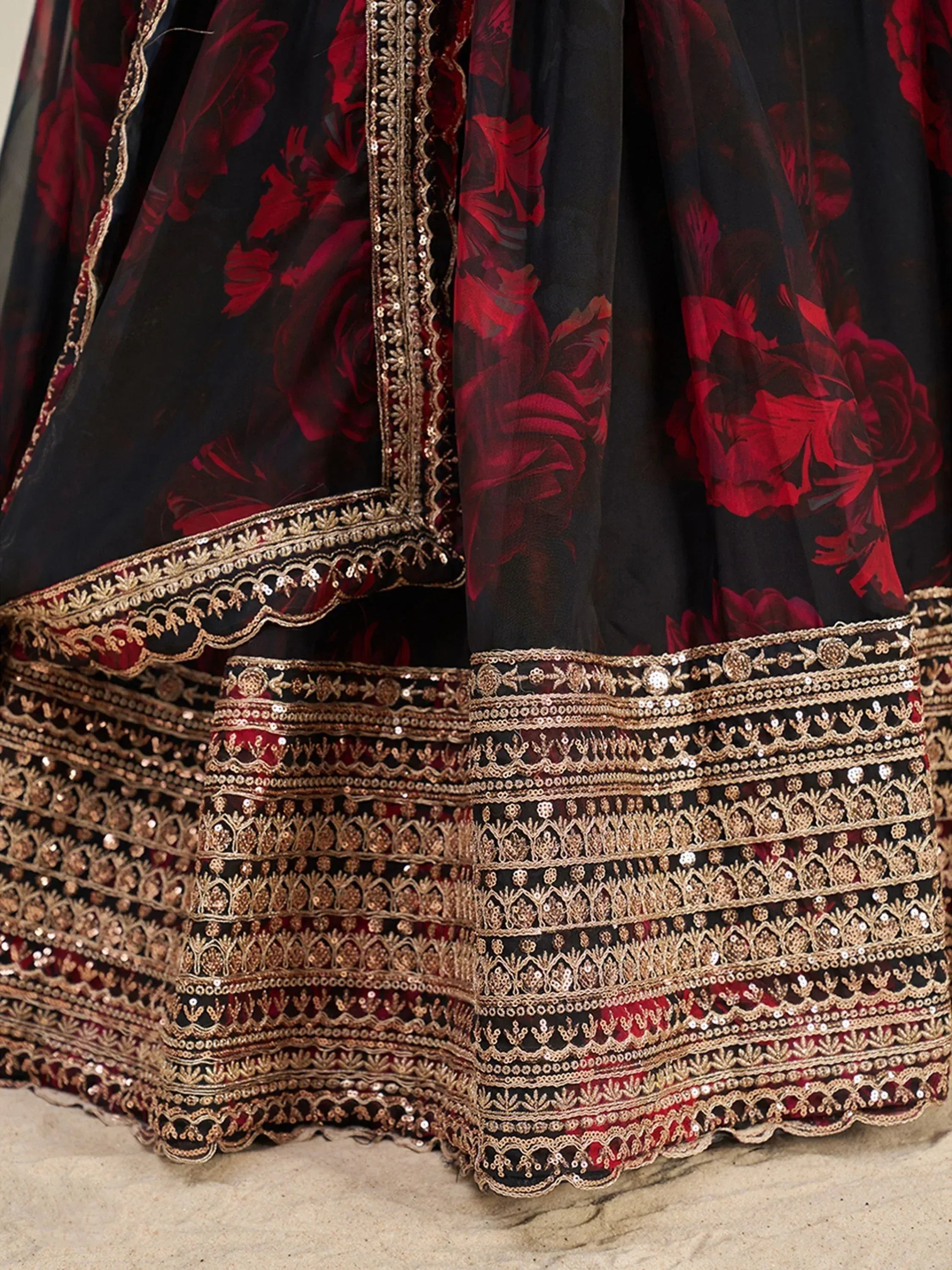 Black and red floral lehenga with gold embroidery and sequin detailing, ethnic Indian wear