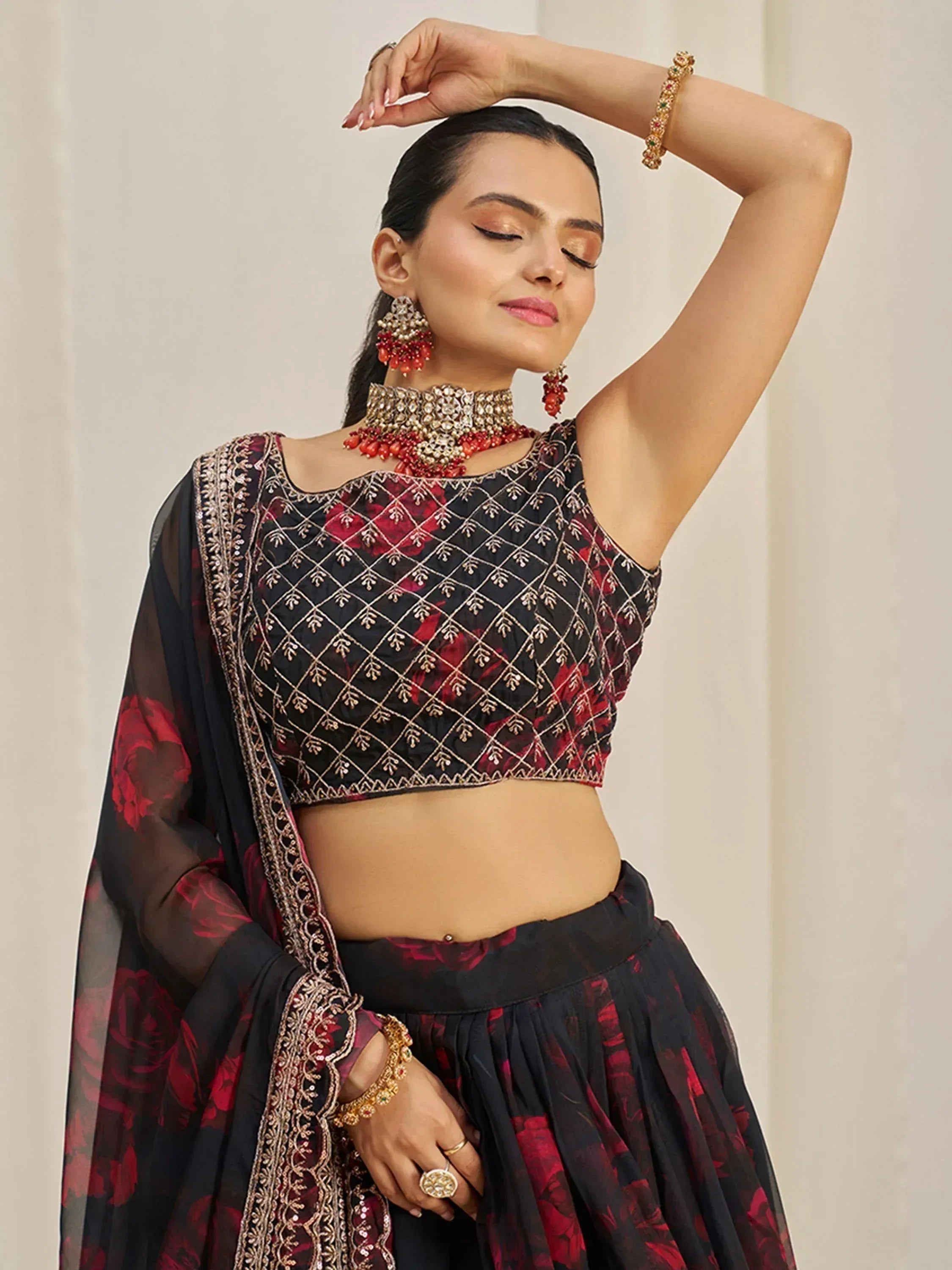 Black and red floral lehenga choli with gold embroidery, perfect for Indian ethnic wear events